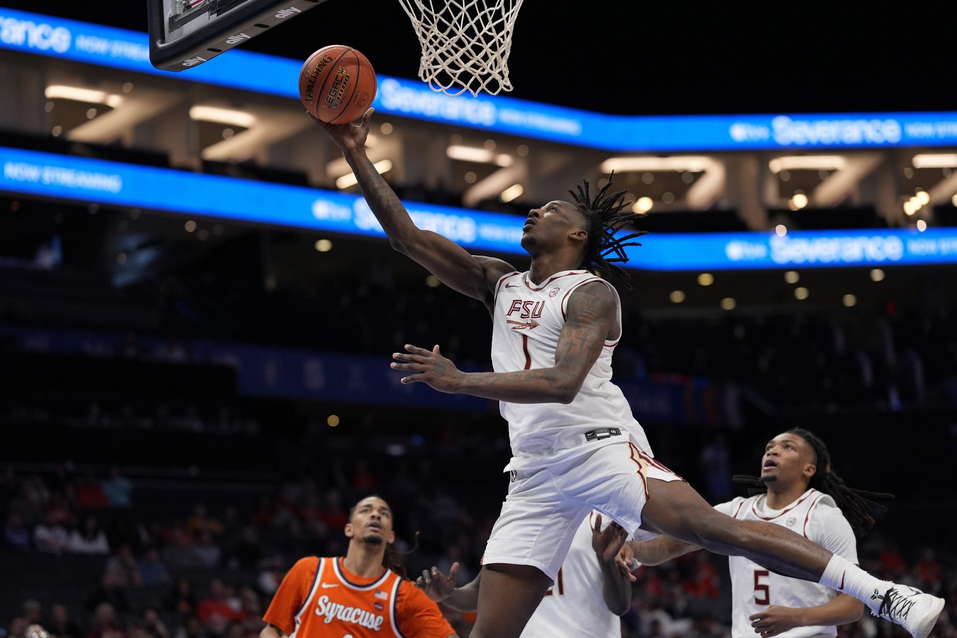 Florida State Seminoles guard Jamir Watkins (1) drives to the basket against the Syracuse Orange during the second half at Spectrum Center.