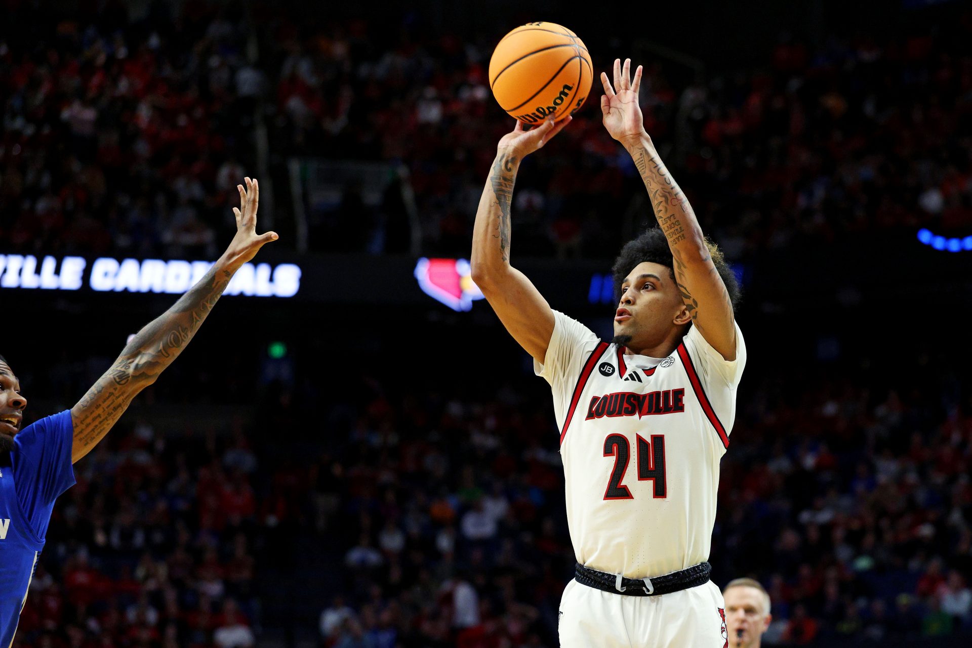 Louisville Cardinals guard Chucky Hepburn (24) shoots the ball during the second half against the Creighton Bluejays in the first round of the NCAA Tournament at Rupp Arena.