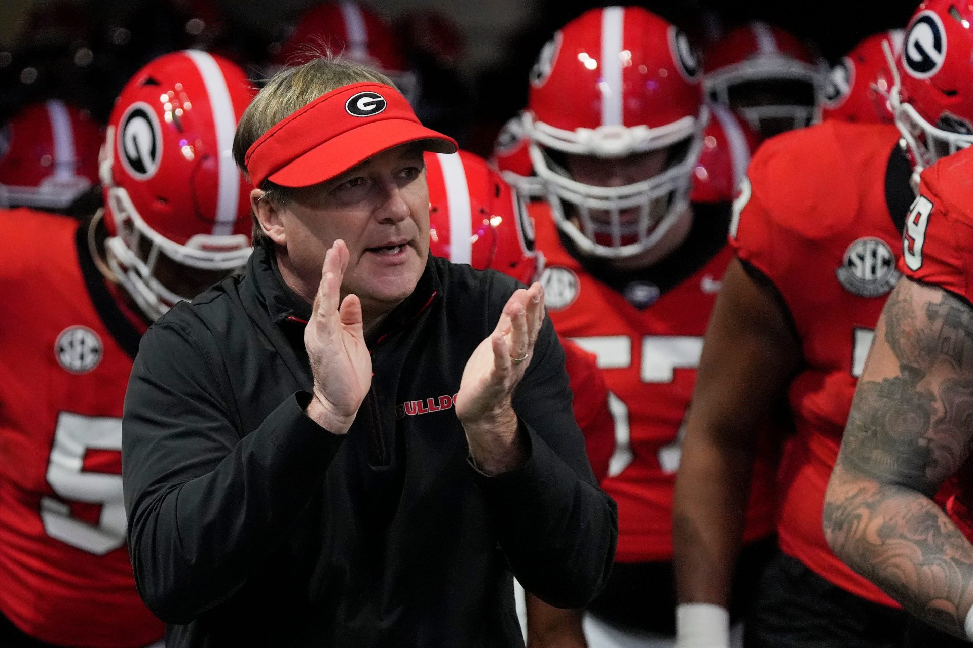Georgia coach Kirby Smart takes the field with his team before the start of the SEC championship game against Texas in Atlanta, on Saturday, Dec. 7, 2024.