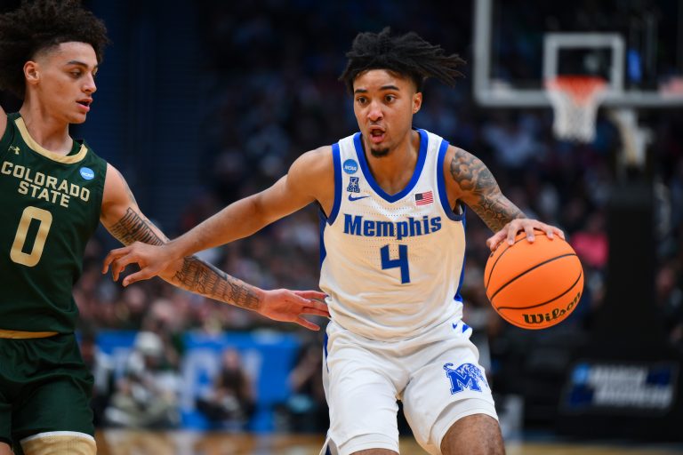 Memphis Tigers guard PJ Haggerty (4) drives the ball during the second half against Colorado State Rams at Climate Pledge Arena.