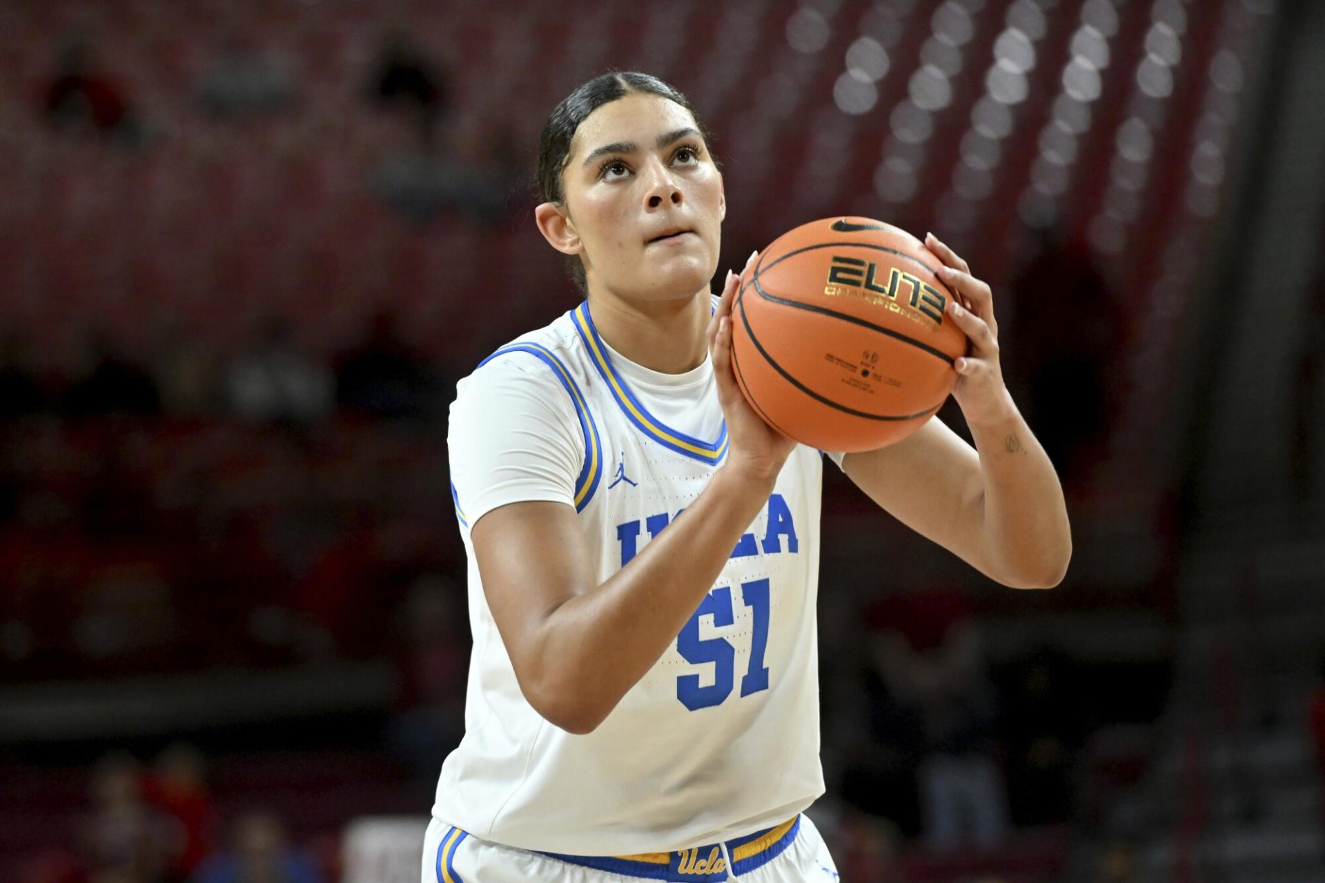UCLA Star Lauren Betts Serves Up BTS Magic in Striking Pink Crop Tee and Black Under Armour Fit