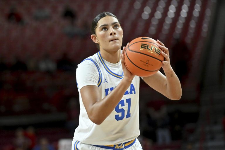 UCLA Star Lauren Betts Serves Up BTS Magic in Striking Pink Crop Tee and Black Under Armour Fit