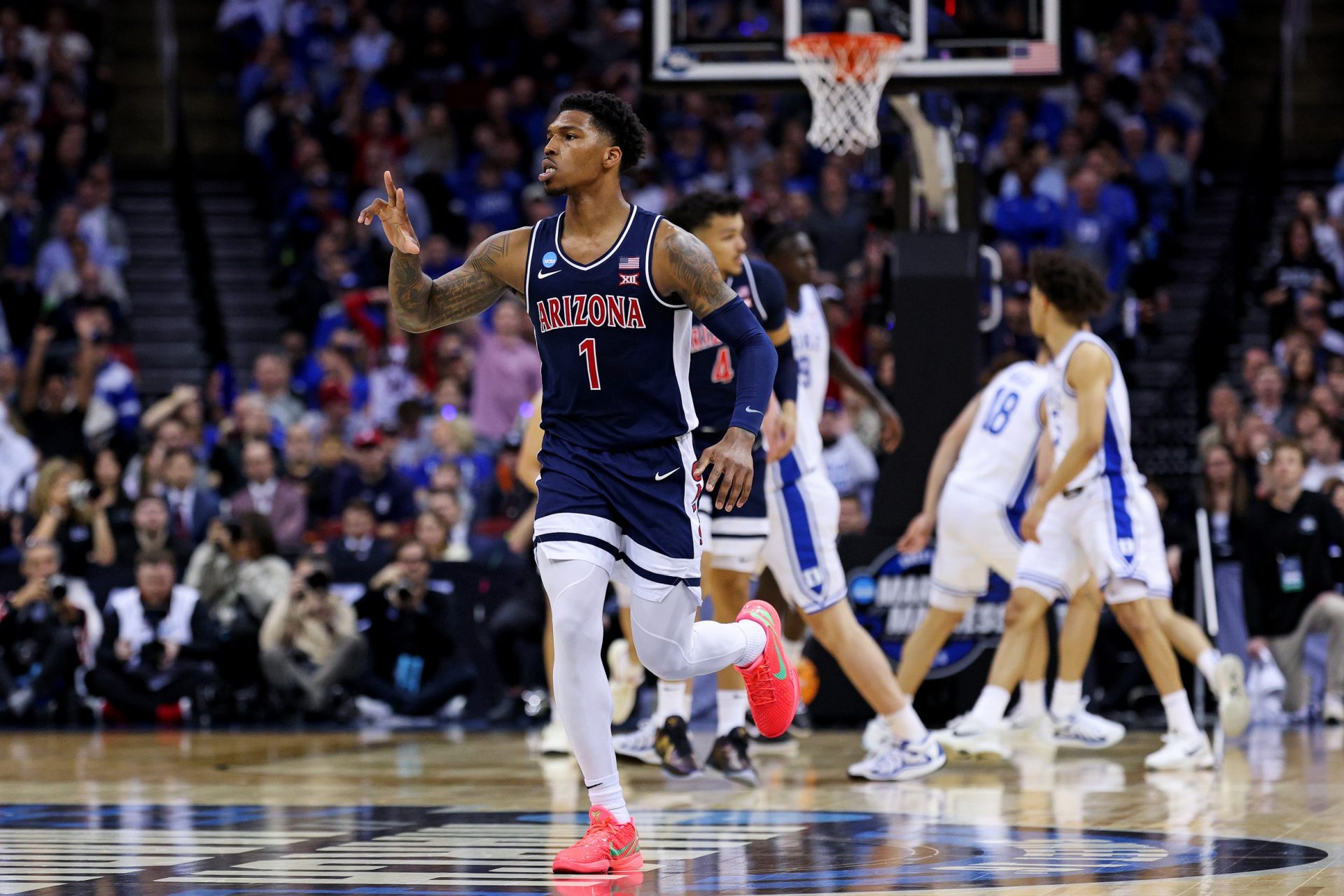 Arizona Wildcats guard Caleb Love (1) celebrates after a play during the first half against the Duke Blue Devils during an East Regional semifinal of the 2025 NCAA tournament at Prudential Center.