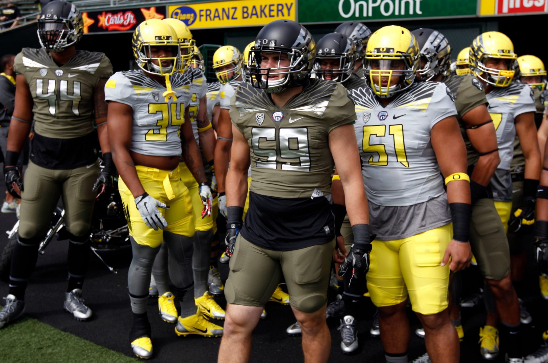 Duck Football players wait to take the field for warmups in their new uniforms for the annual Oregon Spring Game at Autzen.