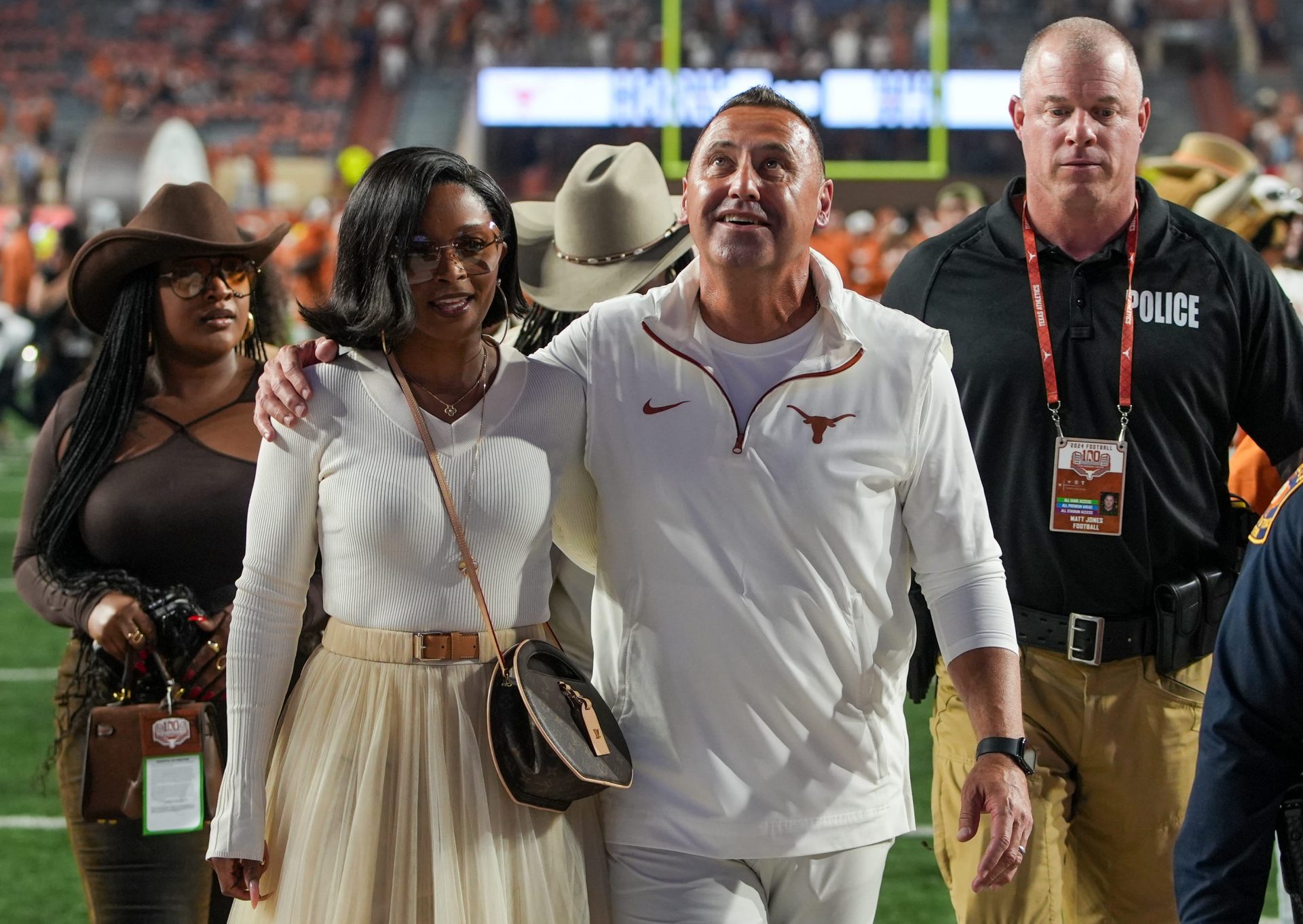 Texas Longhorns head coach Steve Sarkisian and his wife Loreal Sarkisian walk off the field after winning 31-14 against Kentucky Wildcats during the first half of an NCAA college football game at Darrell K Royal Texas Memorial Stadium, Austin, Texas, Saturday, Nov 24, 2024.