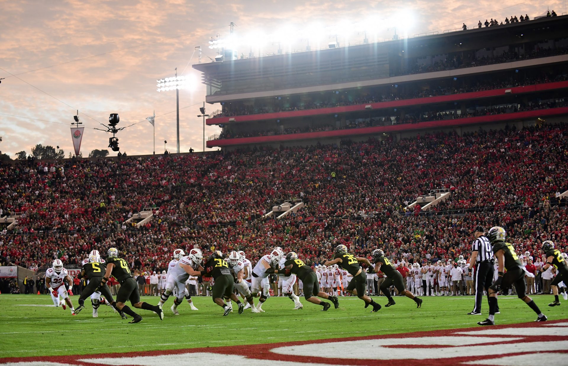 General view of game action at sunset during the second half during the 106th Rose Bowl game between the Oregon Ducks and the Wisconsin Badgers at Rose Bowl Stadium.