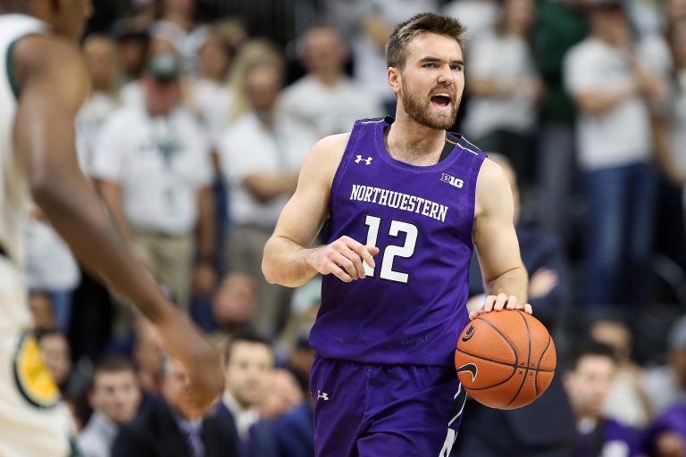 Northwestern Wildcats guard Pat Spencer (12) brings the ball up court during the first half a game against the Michigan State Spartans at the Breslin Center.