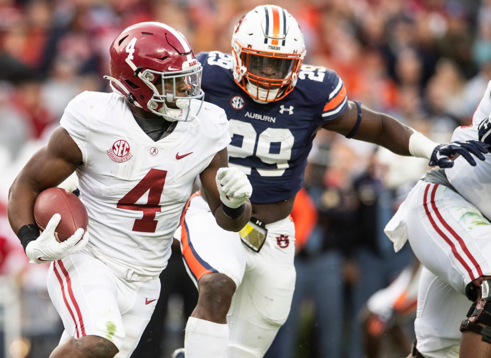 Alabama Crimson Tide running back Brian Robinson Jr. (4) runs the ball during the Iron Bowl at Jordan-Hare Stadium in Auburn, Ala., on Saturday, Nov. 27, 2021. Auburn Tigers leads Alabama Crimson Tide 7-0 at halftime.