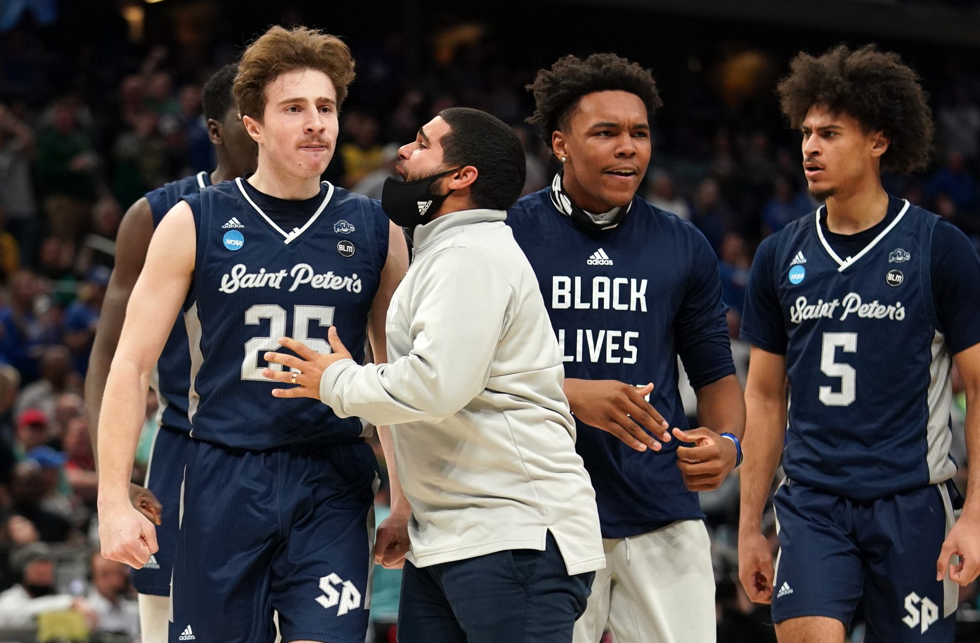 Saint Peter's Peacocks guard Doug Edert (25) reacts after a play against the Kentucky Wildcats during the first round of the 2022 NCAA Tournament at Gainbridge Fieldhouse.