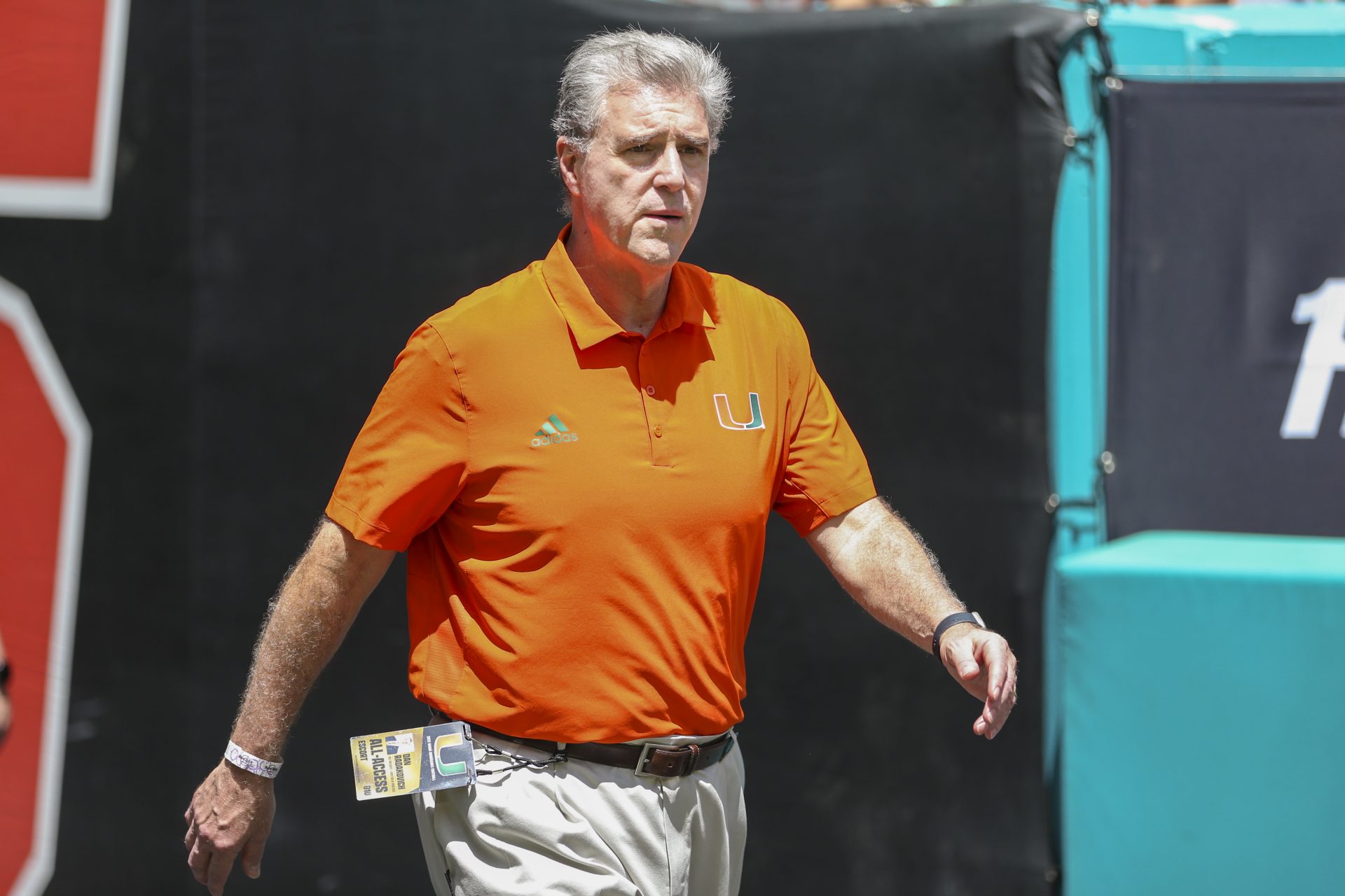 University of Miami Athletic Director Dan Radakovich walks on the field prior to the game against Bethune Cookman Wildcats at Hard Rock Stadium.