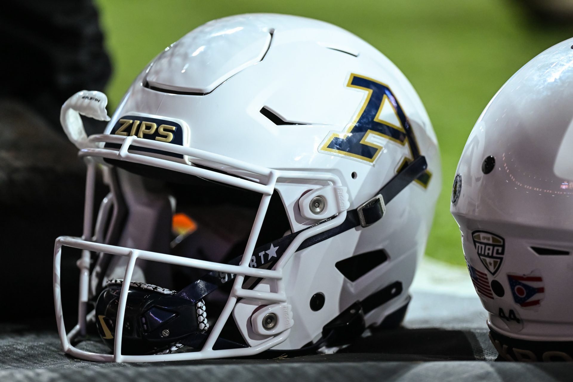 Akron Zips helmets sit on the sidelines in the game against the Tennessee Volunteers at Neyland Stadium.