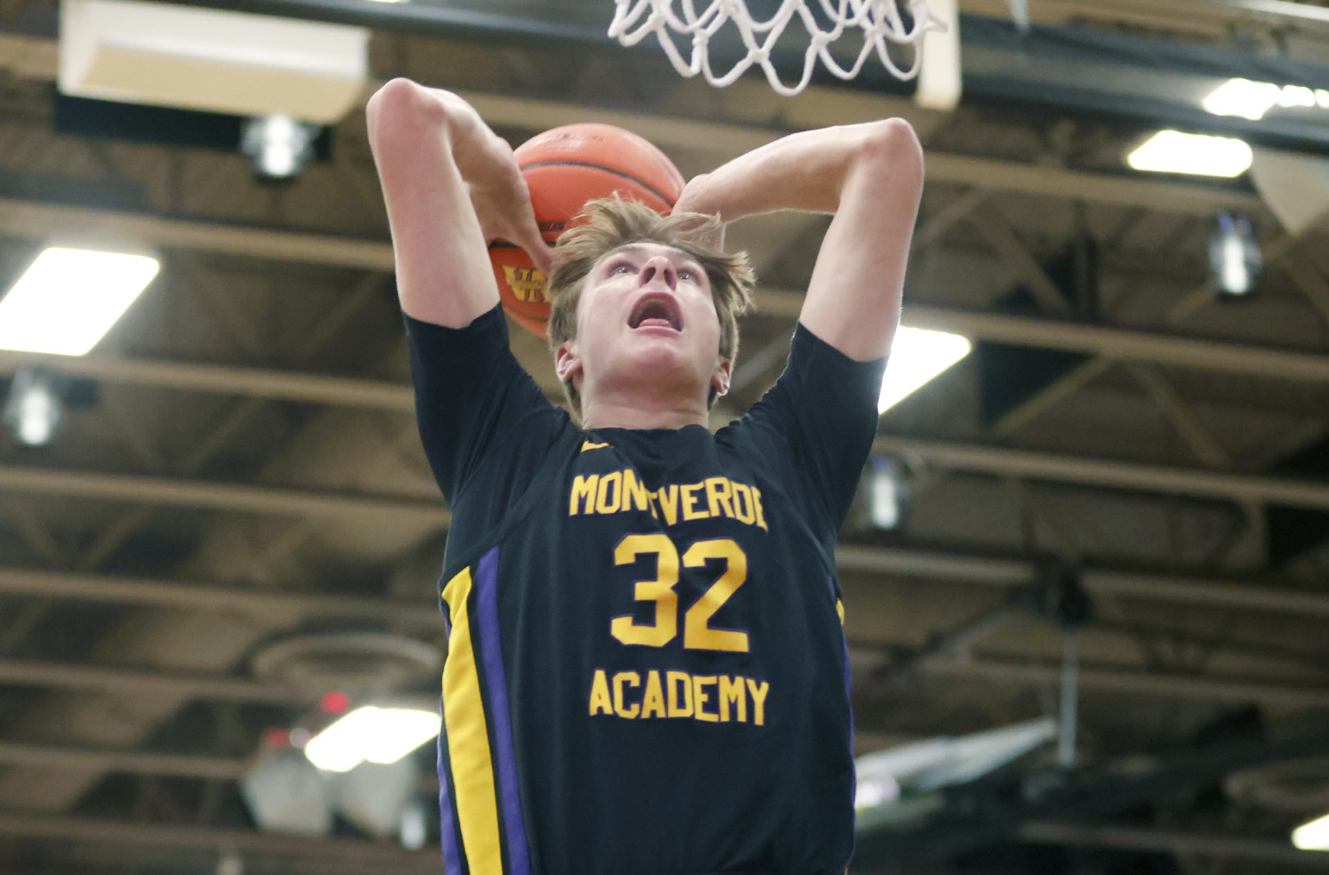 Montverde Academy forward Cooper Flagg (32) dunks the ball during the second quarter of the Sunshine Classic basketball tournament against IMG Academy at Mills Championship Court on the campus of Montverde Academy.