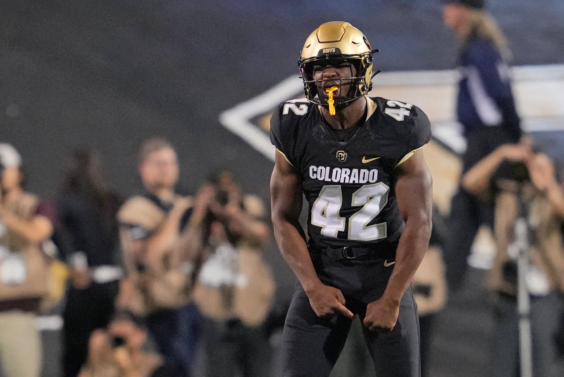 Colorado Buffaloes linebacker Jeremiah Brown (42) reacts after a fumble against the Colorado State Rams during the first half at Folsom Field.