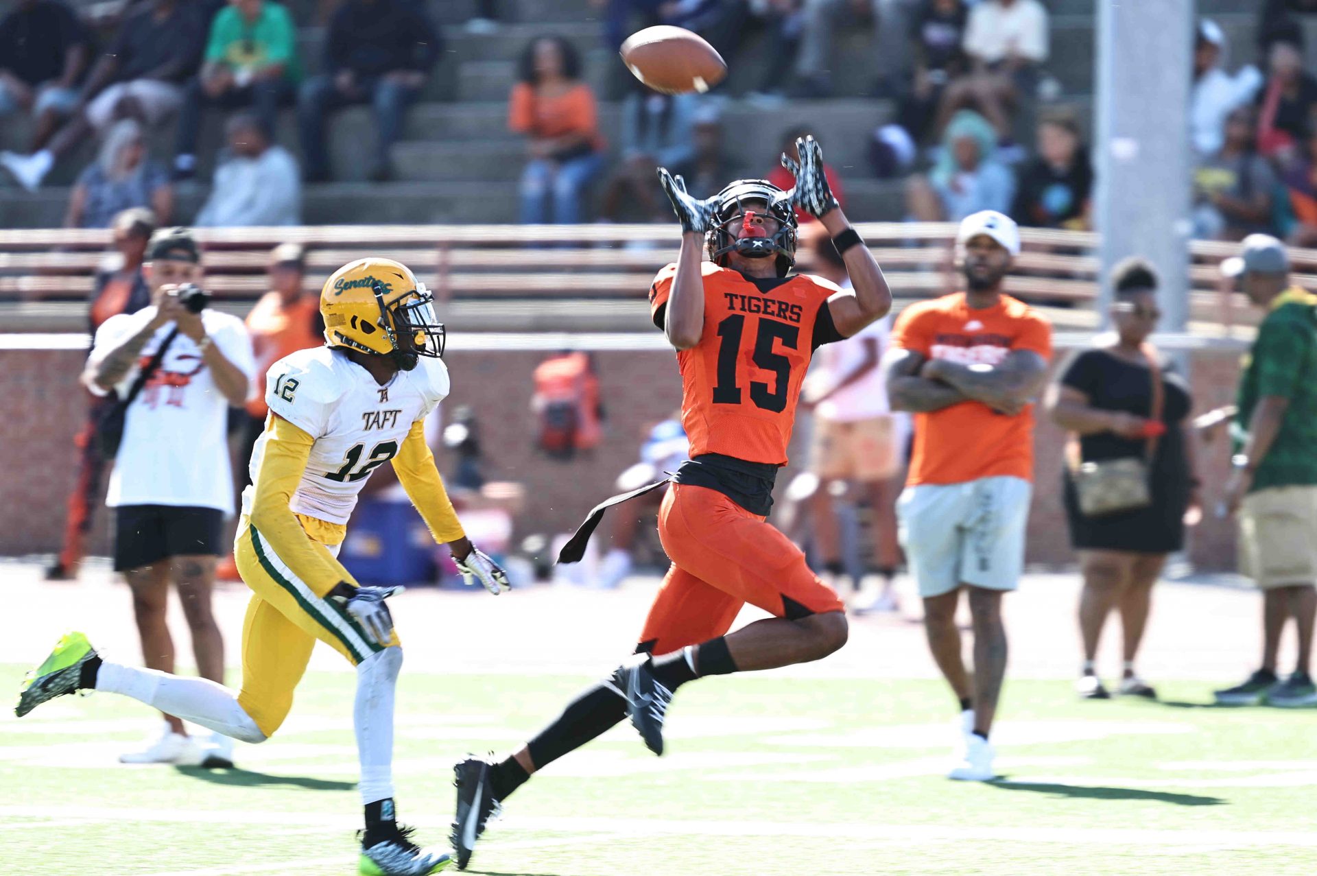 Withrow wide receiver Chris Henry Jr. (15) catches a touchdown pass in front of Taft's Quinton Price (12) during the Tigers' 31-0 win over Taft Saturday, Sept. 23. 2023.