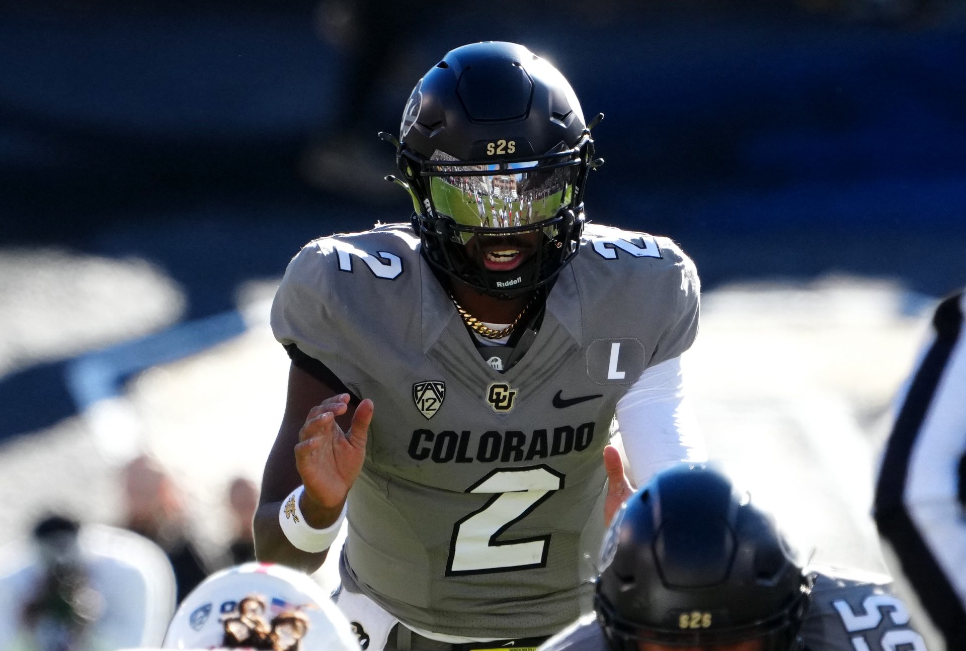 Colorado Buffaloes quarterback Shedeur Sanders (2) at the line of scrimmage in the first half against the Arizona Wildcats at Folsom Field.