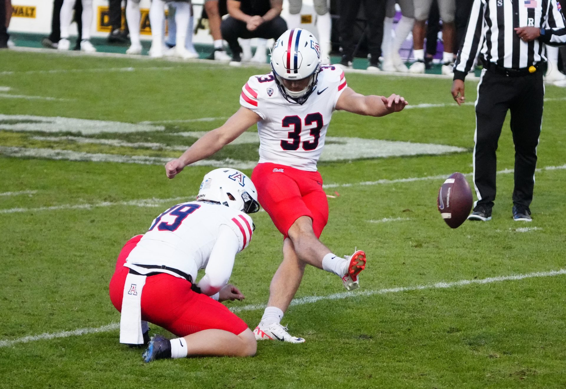 Arizona Wildcats place kicker Tyler Loop (33) kicks the winning field goal in the fourth quarter against the Colorado Buffaloes at Folsom Field.