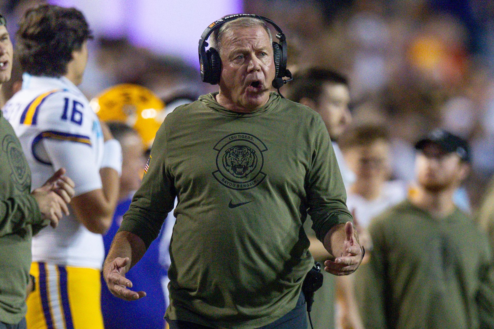 LSU Tigers head coach Brian Kelly walks the sideline against the Florida Gators during the first half at Tiger Stadium.