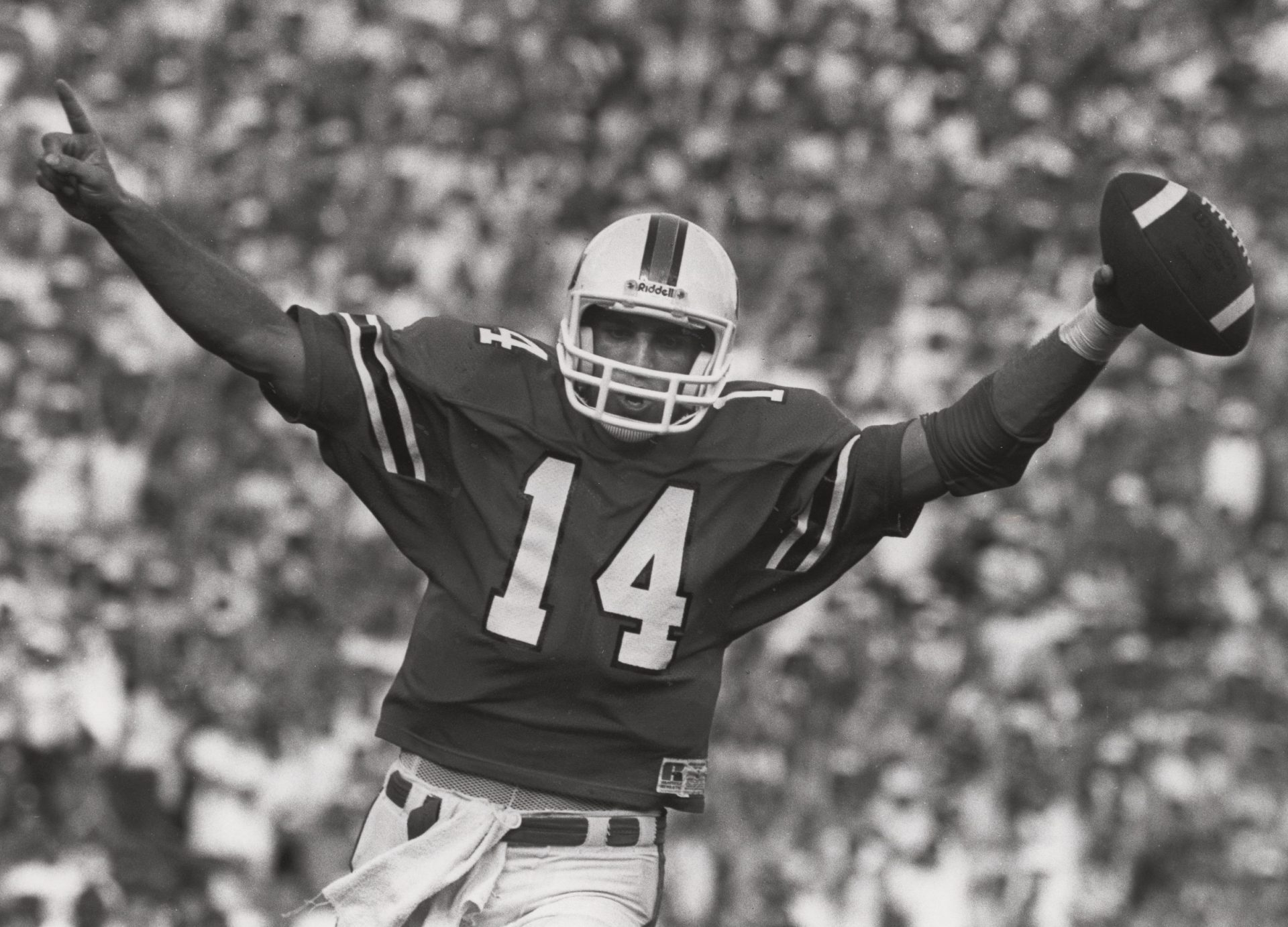 FILE PHOTO; Miami Hurricanes quarterback Vinny Testaverde (14) celebrates as he scores against Florida State at the Orange Bowl. Miami defeated FSU 41-23.