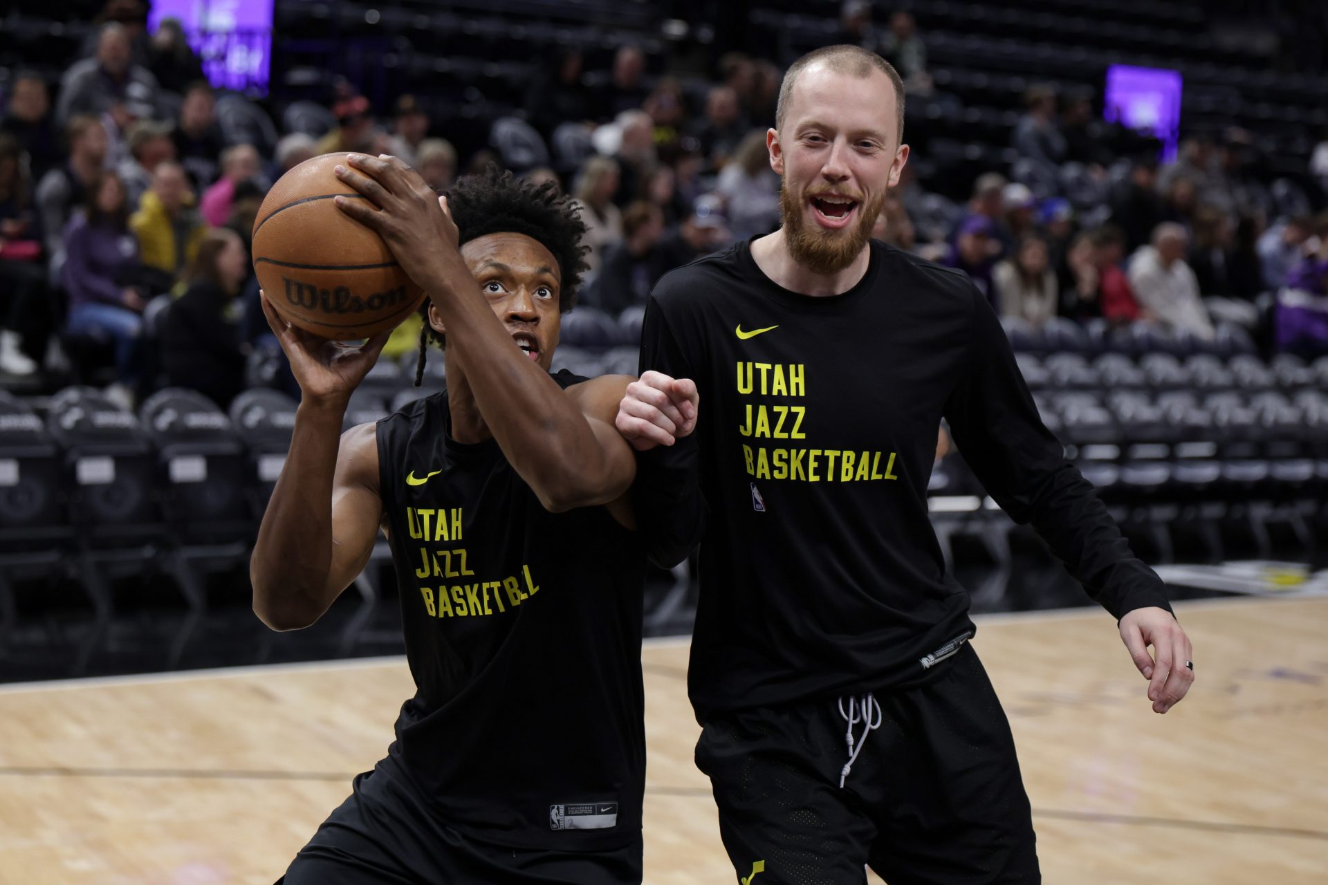 Utah Jazz guard Collin Sexton (2) warms up with assistant coach Evan Bradds before the game against the Milwaukee Bucks at Delta Center.
