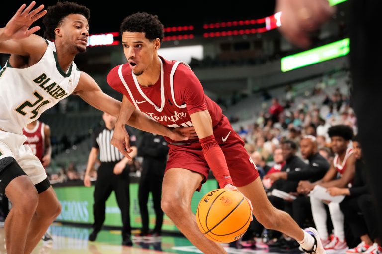 Temple Owls forward Steve Settle III (14) drives to the basket as UAB Blazers guard Efrem Johnson (24) defends during the second half at Dickies Arena.