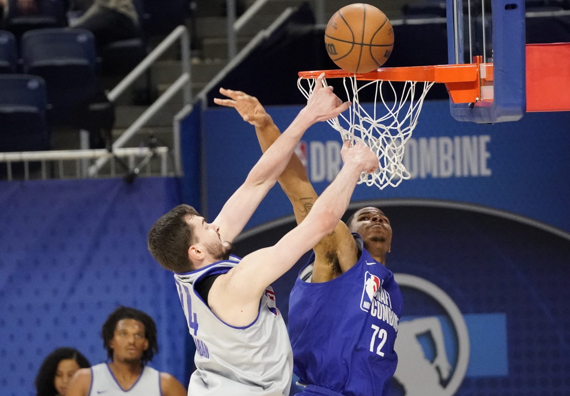 Alex Karaban (74) and Keshad Johnson (72) participate during the 2024 NBA Draft Combine at Wintrust Arena.