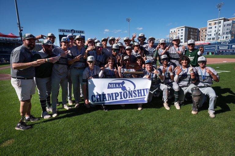 Players and coaches from the Oakmont baseball team pose with their trophy and championship banner after defeating St. Mary’s, 3-1, in the D3 State Championship at Polar Park in Worcester on Saturday June 15, 2024.