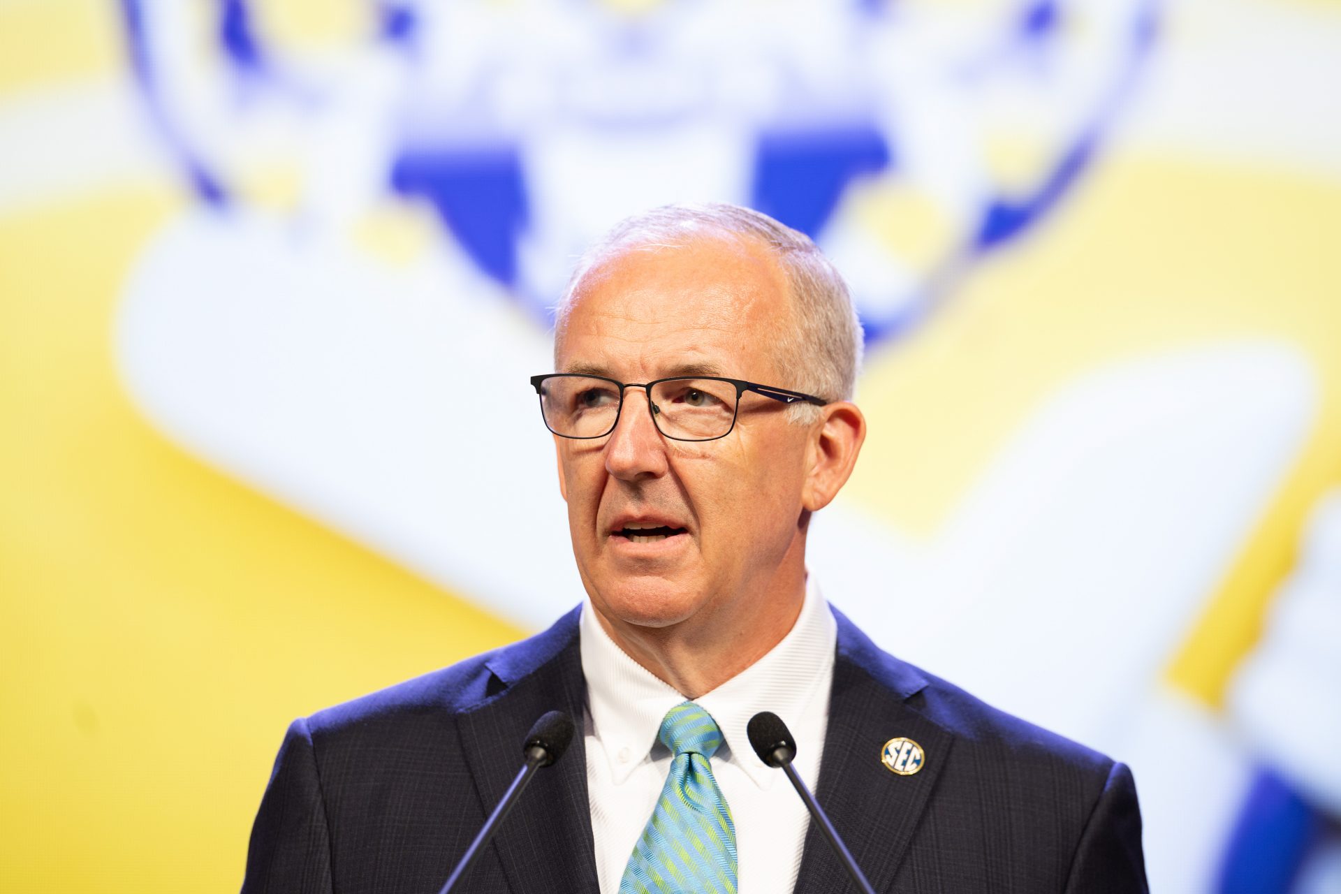 SEC commissioner Greg Sankey speaking at Omni Dallas Hotel.
