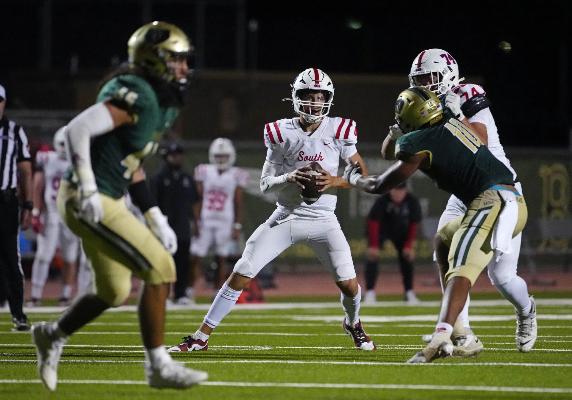 Millard South Jett Thomalla (4) looks for receivers against Basha during a game at Basha High School in Chandler on Aug. 30, 2024.