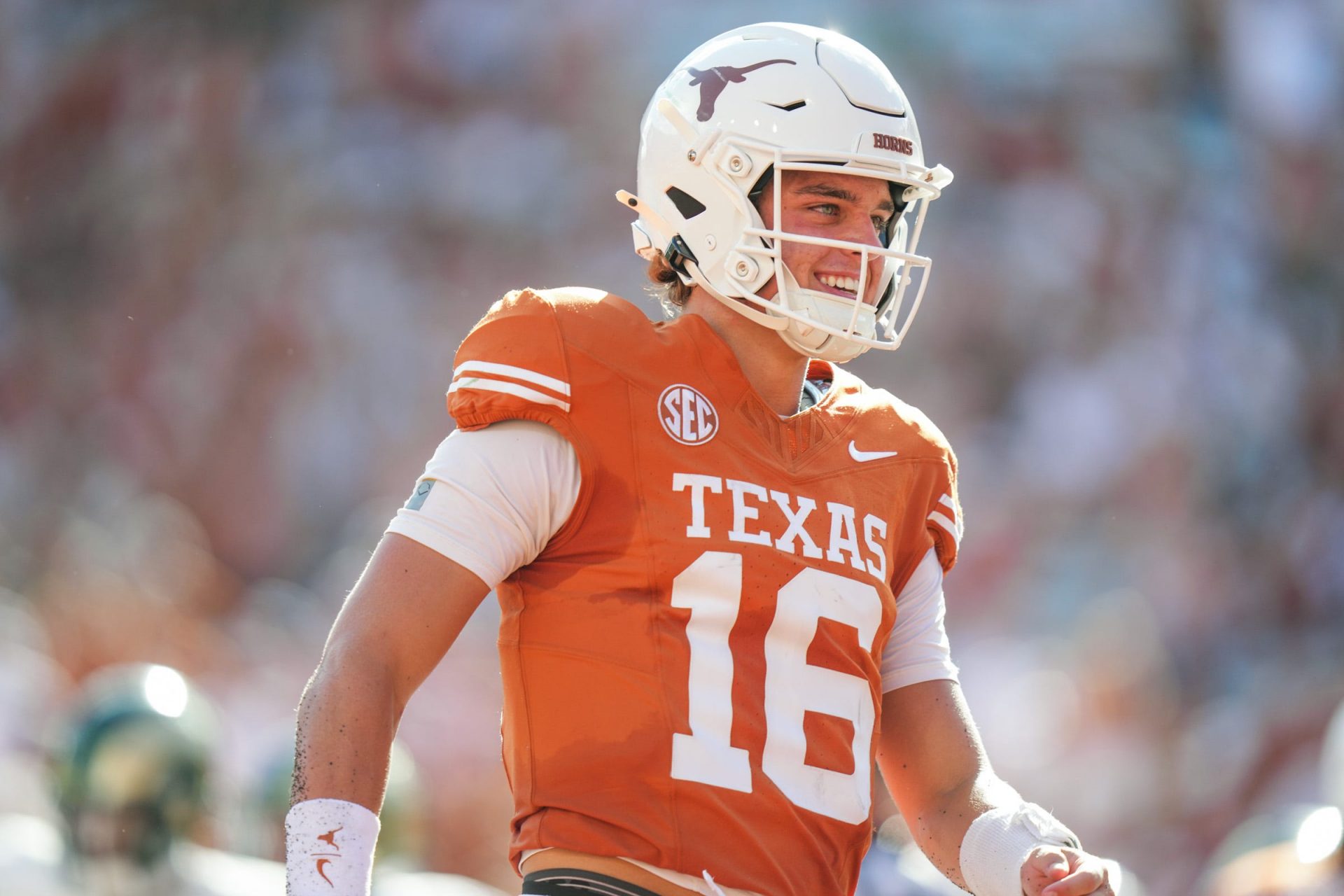 Texas Longhorns quarterback Arch Manning (16) smiles after scoring a touch down as the Texas Longhorns take on Colorado State at Darrell K Royal-Texas Memorial Stadium in Austin Saturday, Aug. 31, 2024.