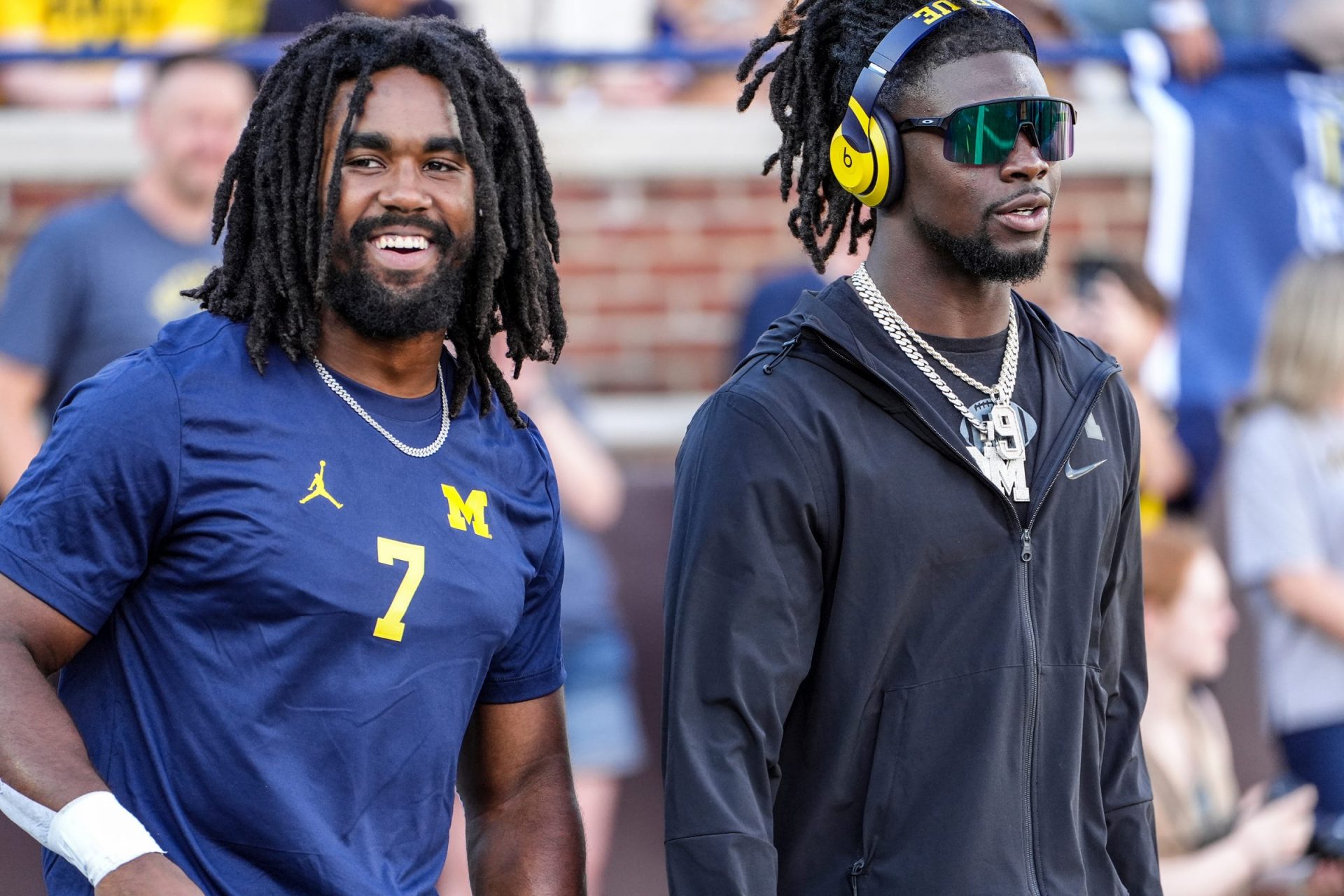 Michigan running back Donovan Edwards (7) and Michigan defensive back Rod Moore (9) warm up before the start before the game against Fresno State at Michigan Stadium in Ann Arbor on Saturday, Aug. 31, 2024.
