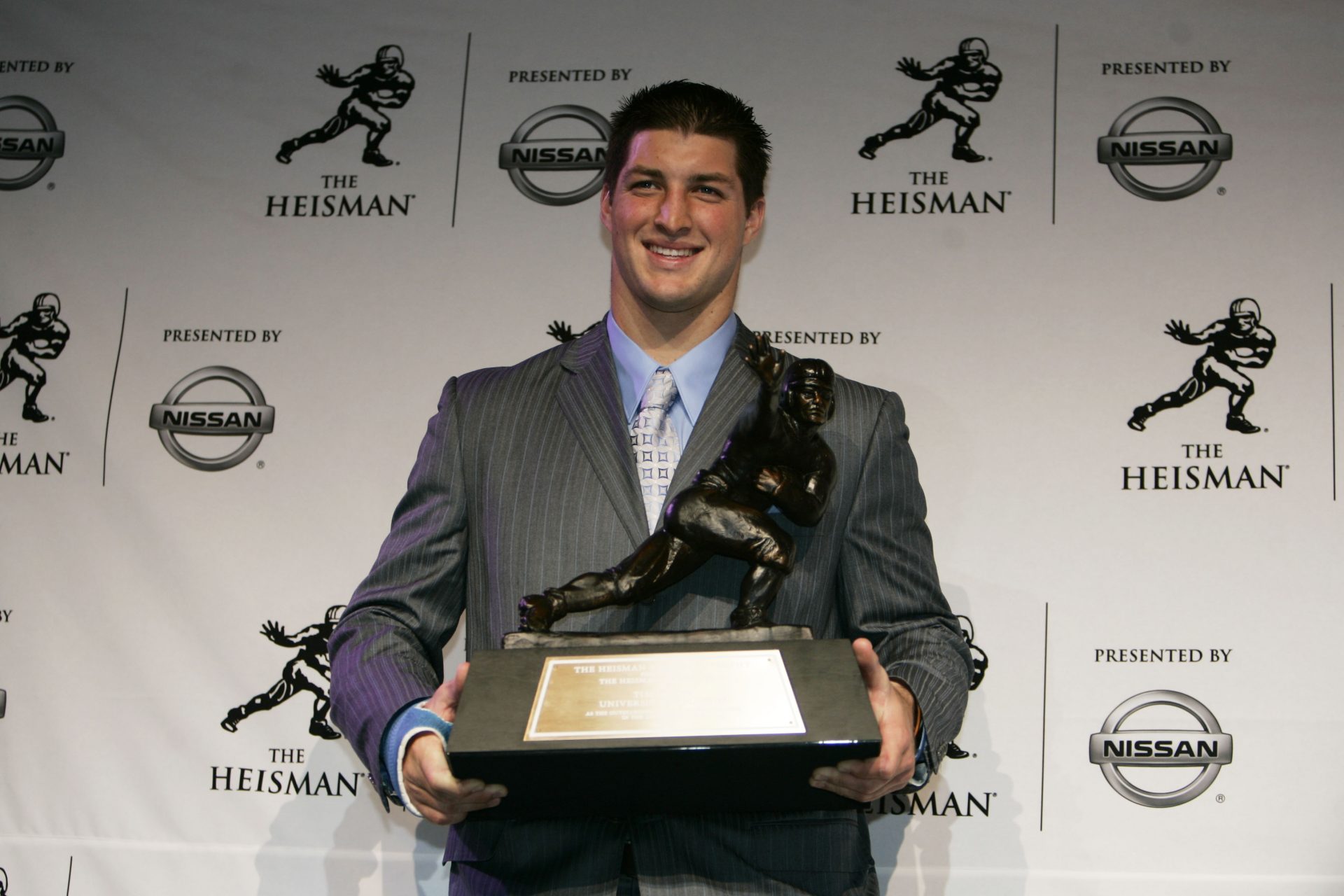 Florida Gators quarterback Tim Tebow poses with the Heisman Trophy as he addresses the media at the Hard Rock Cafe after being awarded the 2007 Heisman Trophy in New York City.