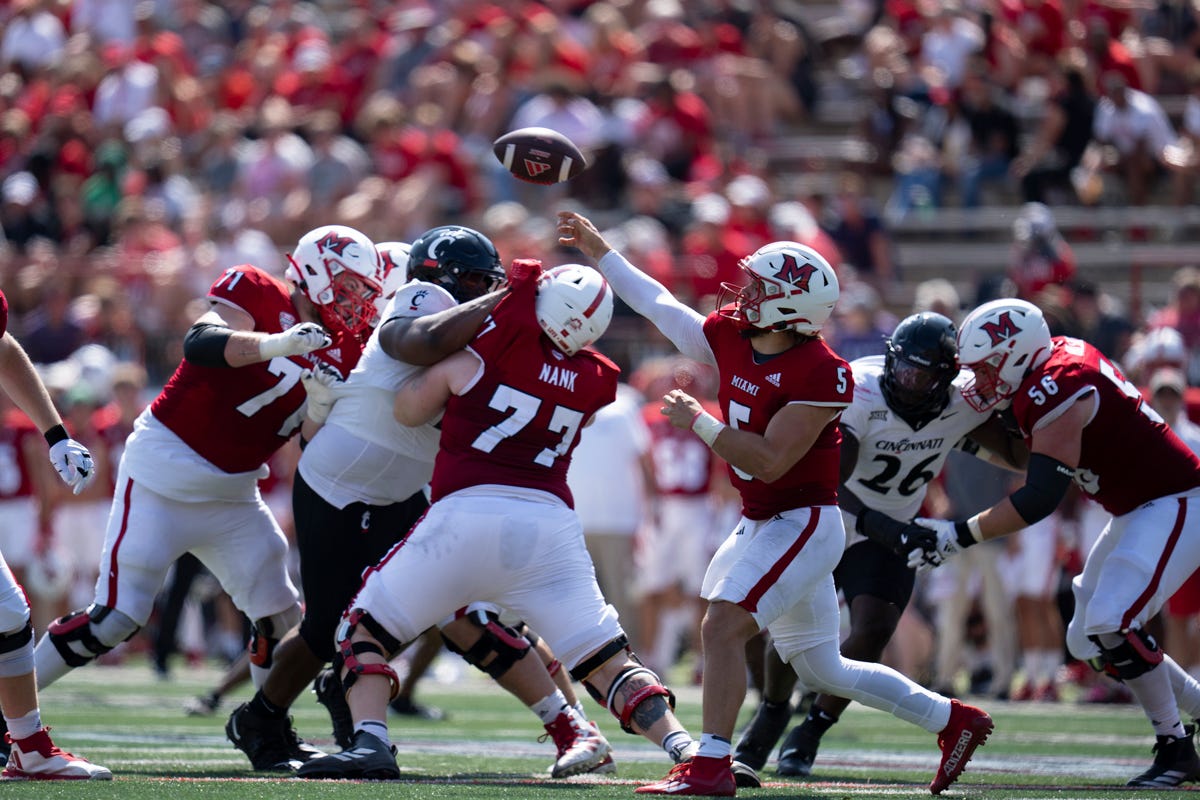 Miami Redhawks quarterback Brett Gabbert (5) throws a pass in the third quarter of the College Football game against the Cincinnati Bearcats at Yager Stadium in Cincinnati on Saturday, Sept. 14, 2024.