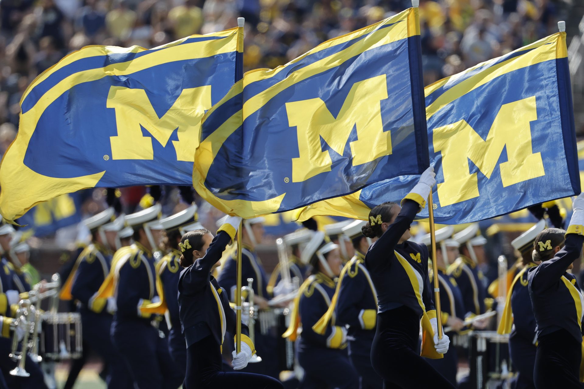 Michigan Wolverines marching band take the field before a game against the Arkansas State Red Wolves at Michigan Stadium.