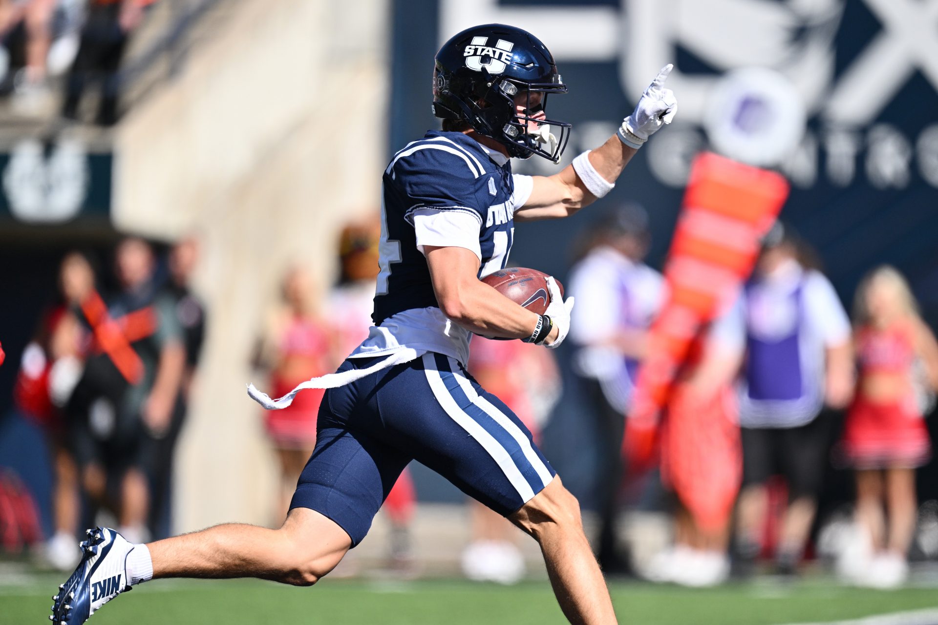 Utah State Aggies wide receiver Jack Hestera (14) catches a touchdown pass in the first half against the Utah Utes at Merlin Olsen Field at Maverik Stadium.