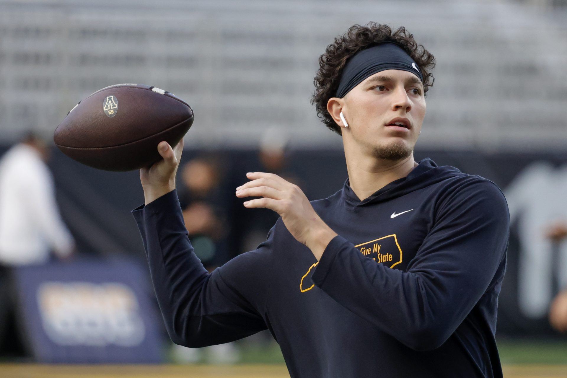 Appalachian State Mountaineers quarterback Joey Aguilar (4) throws a warmup pass before the game against the South Alabama Jaguars at Kidd Brewer Stadium.