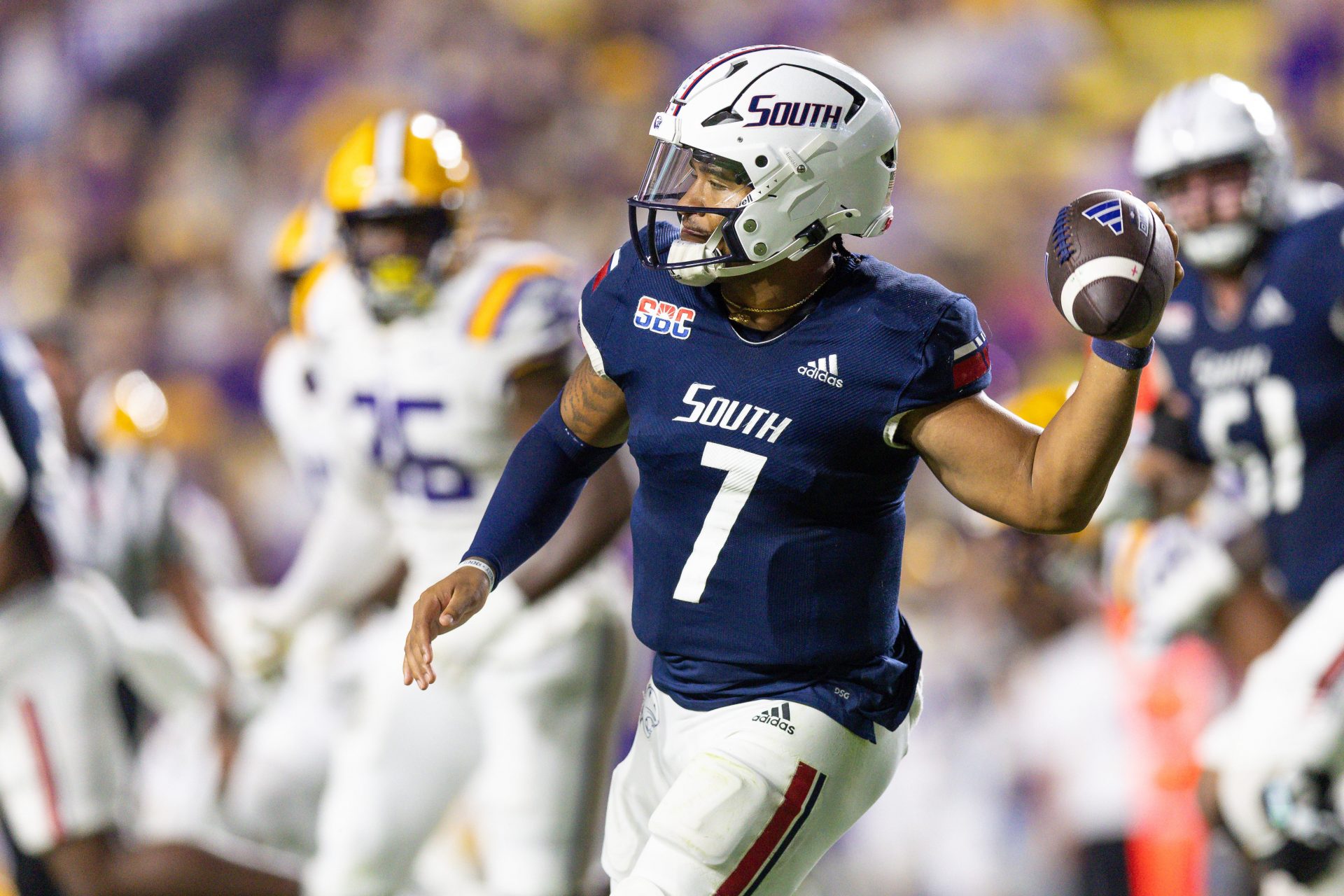 South Alabama Jaguars quarterback Gio Lopez (7) rolls out against the LSU Tigers during the second quarter at Tiger Stadium.