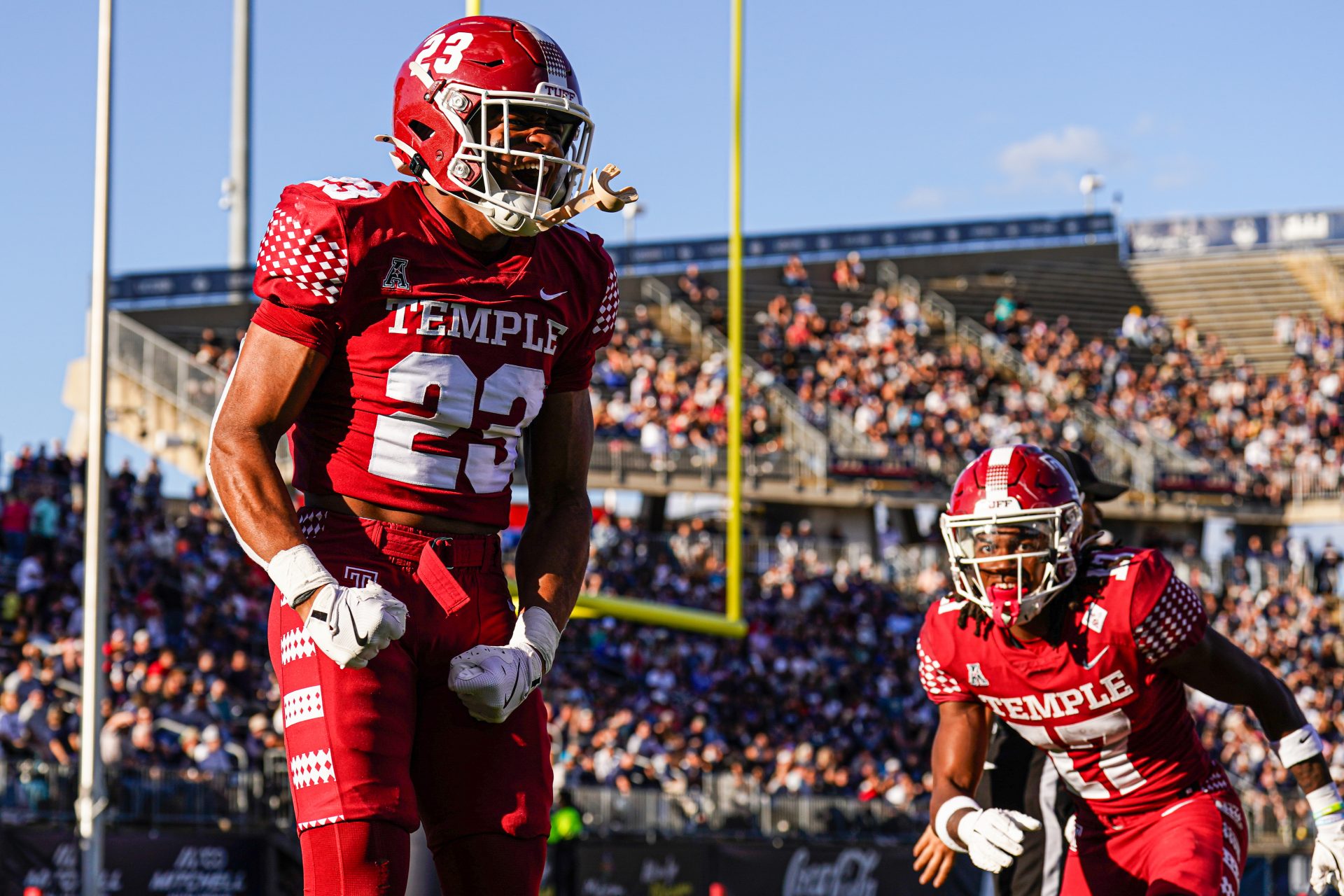 Temple Owls linebacker Antwone Santiago (23) reacts after blocking a punt while linebacker Tyler Lepolo (17) recovers for a touchdown against the Connecticut Huskies in the second quarter at Rentschler Field at Pratt & Whitney Stadium.