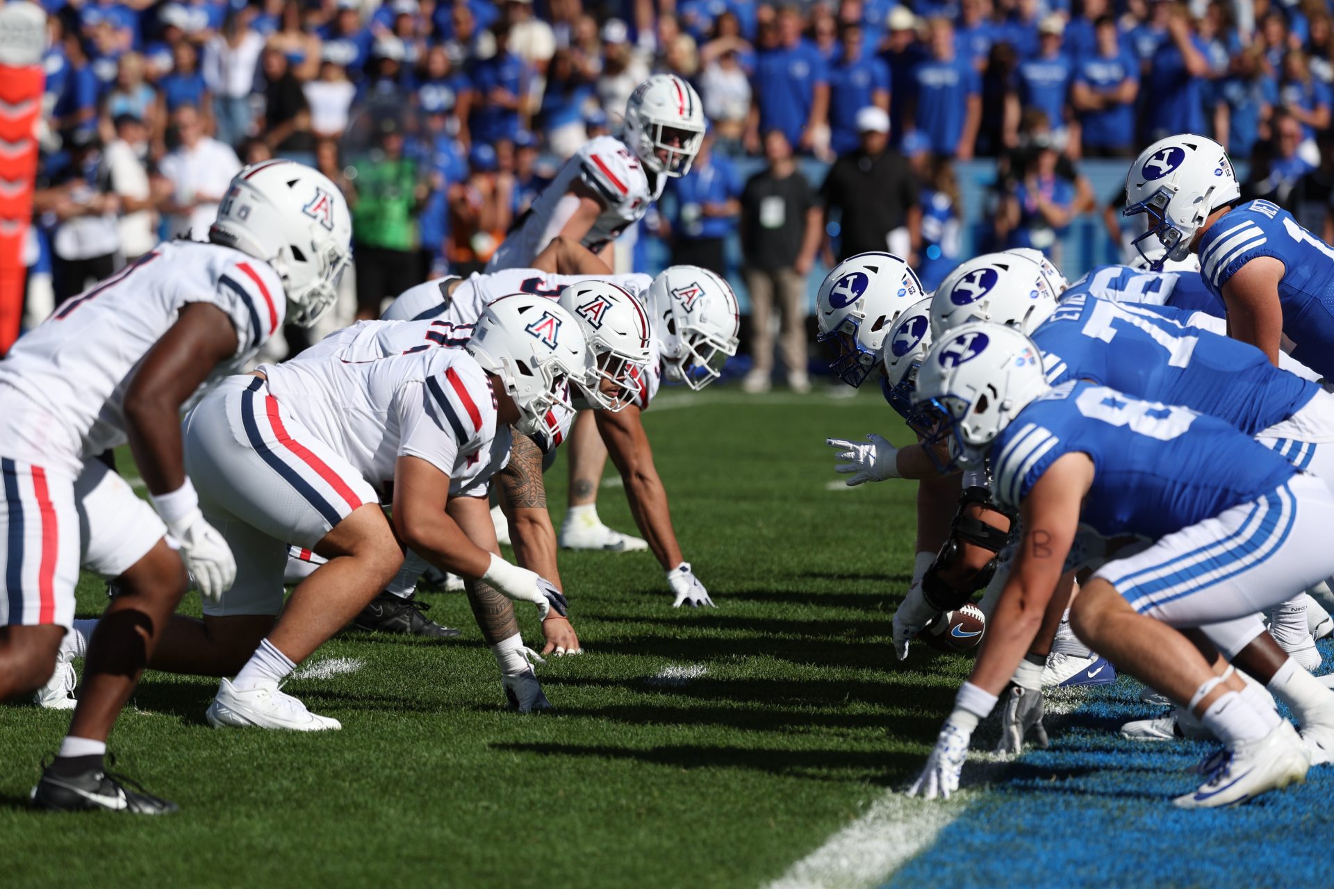The Arizona Wildcats defense lines up against the Brigham Young Cougars offense during the second quarter at LaVell Edwards Stadium.