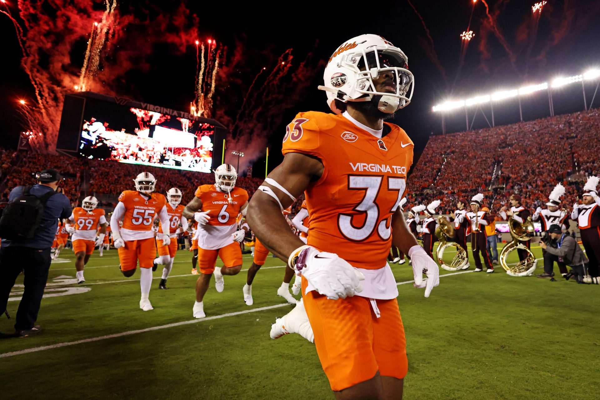 Virginia Tech Hokies cornerback Miles Ellis (33) runs onto the field before paying against the Boston College Eagles at Lane Stadium.