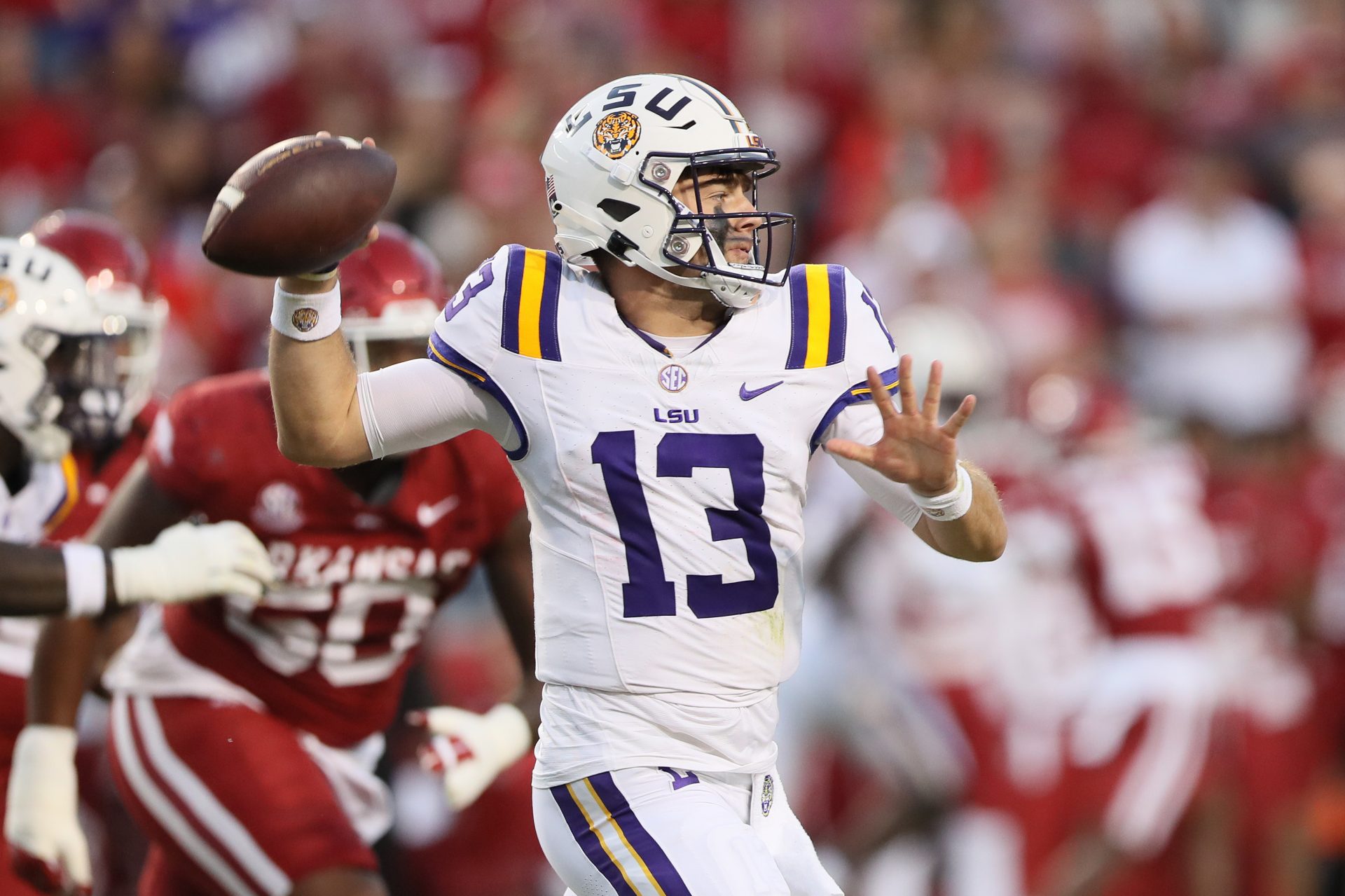 LSU Tigers quarterback Garrett Nussmeier (13) passes during the first quarter against the Arkansas Razorbacks at Donald W. Reynolds Razorback Stadium.