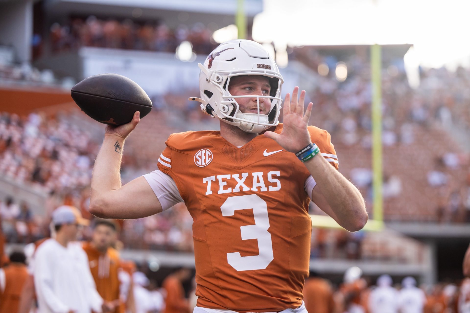 Texas Longhorns quarterback Quinn Ewers (3) warming up against the Georgia Bulldogs at Darrell K Royal-Texas Memorial Stadium.