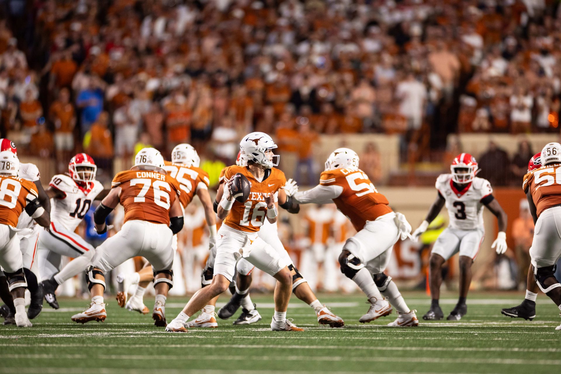 Texas Longhorns quarterback Arch Manning (16) drops back to pass in the second quarter against the Georgia Bulldogs at Darrell K Royal-Texas Memorial Stadium.