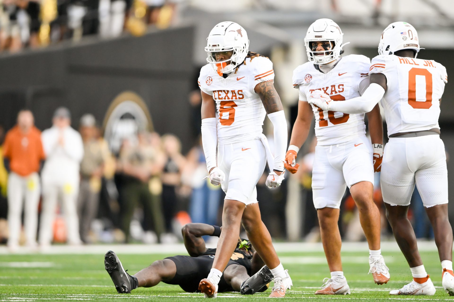 Texas Longhorns running back Christian Clark (6) celebrates the big defensive play against Vanderbilt Commodores wide receiver Quincy Skinner Jr. (3) during the second half at FirstBank Stadium.