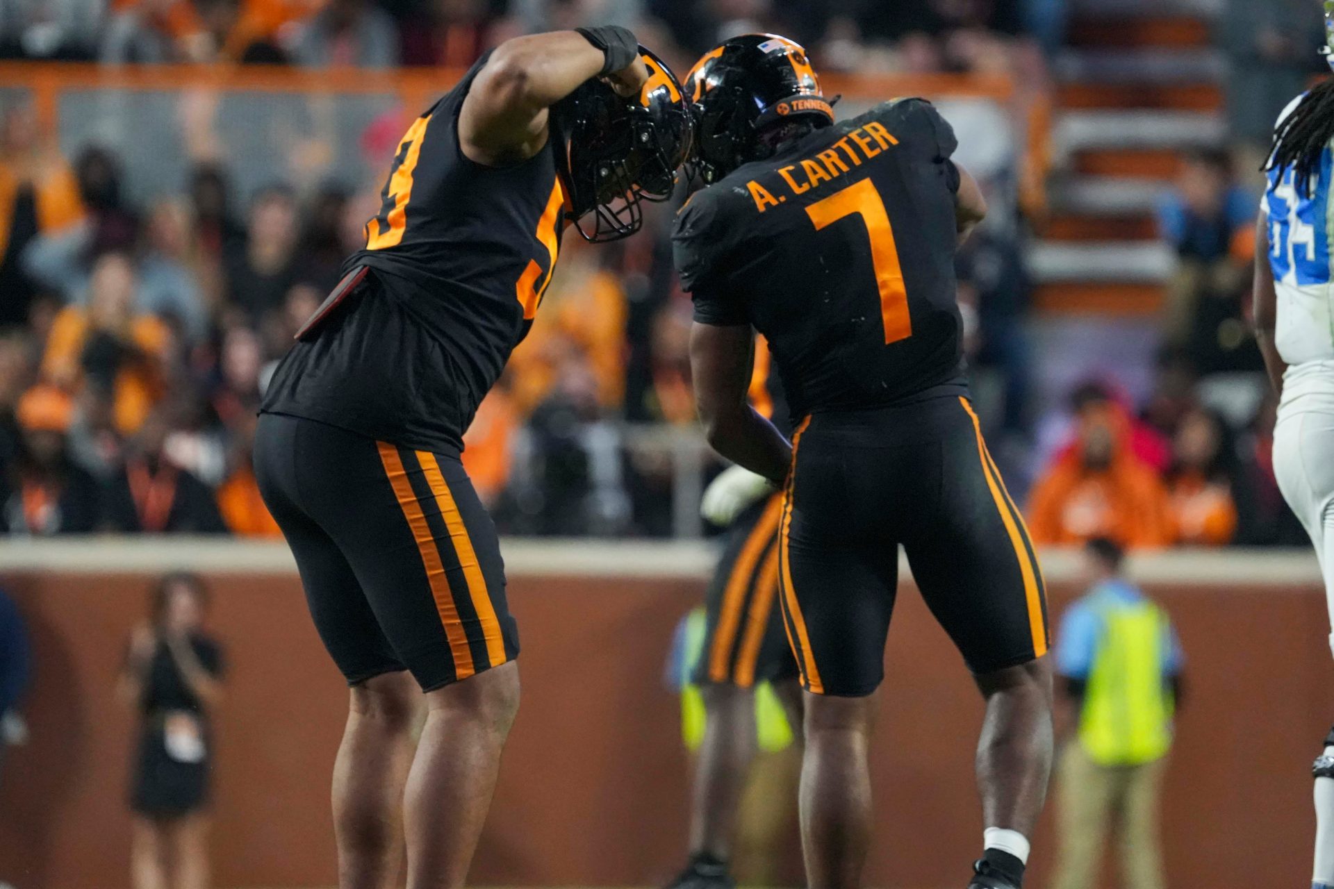 Tennessee defensive lineman Daevin Hobbs (53) and Tennessee linebacker Arion Carter (7) tap helmets after a tackle during a NCAA football game between Tennessee and Kentucky in Neyland Stadium on Saturday, Nov. 2, 2024.