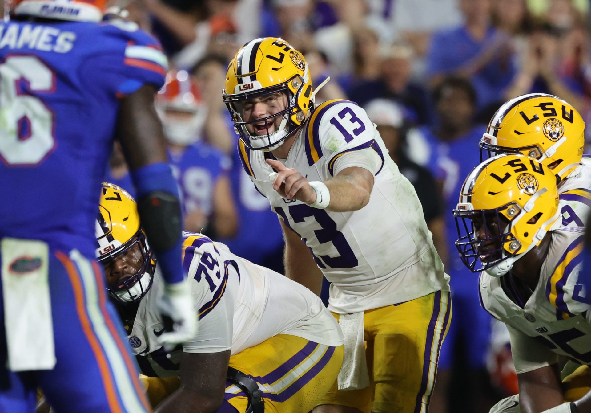 wNov 16, 2024; Gainesville, Florida, USA; LSU Tigers quarterback Garrett Nussmeier (13) calls a play against the Florida Gators during the second half at Ben Hill Griffin Stadium.