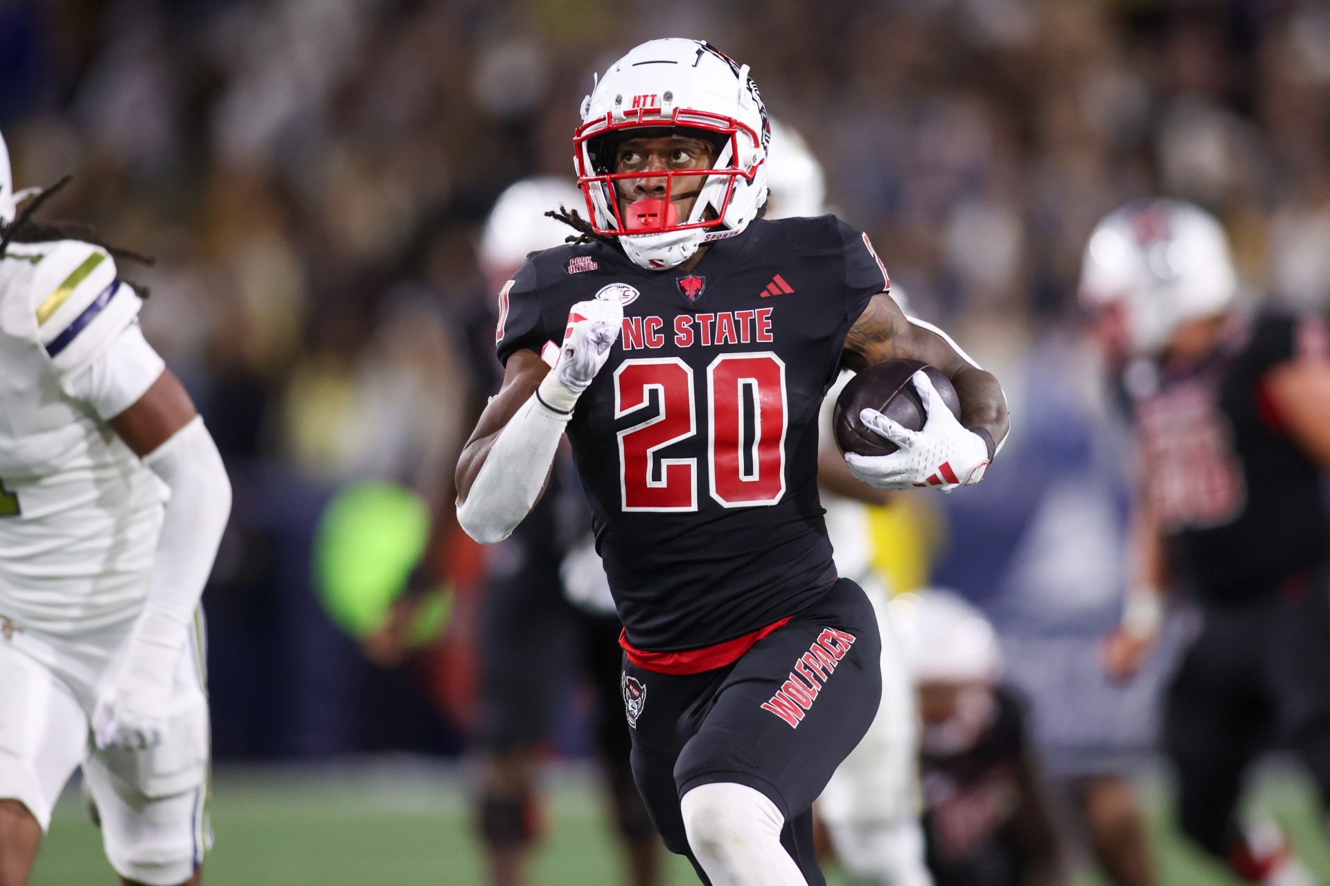 North Carolina State Wolfpack running back Hollywood Smothers (20) runs the ball for a touchdown against the Georgia Tech Yellow Jackets in the fourth quarter at Bobby Dodd Stadium at Hyundai Field.