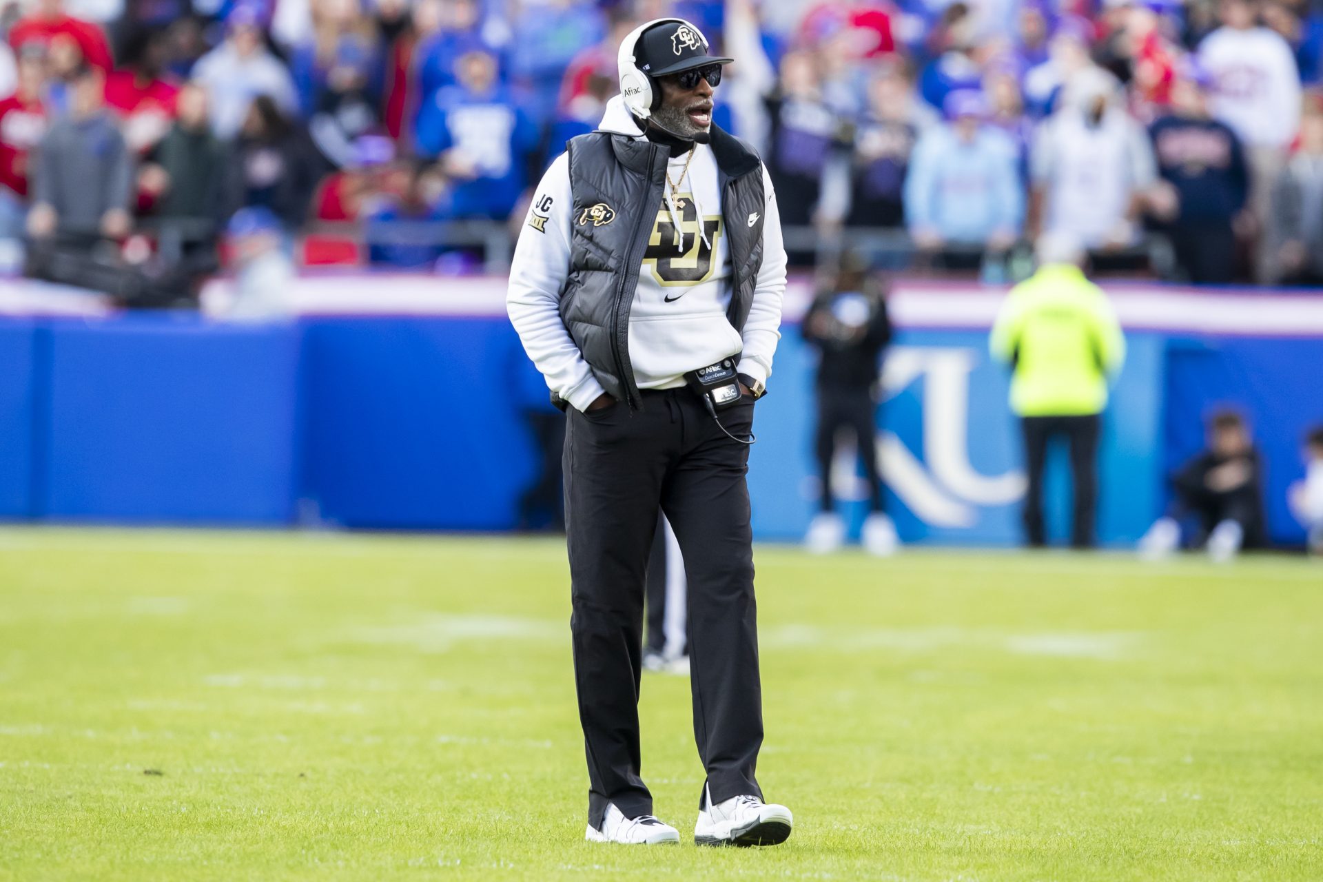 Colorado head coach Deion Sanders paces the field during the 2nd quarter between the Kansas Jayhawks and the Colorado Buffaloes at GEHA Field at Arrowhead Stadium.
