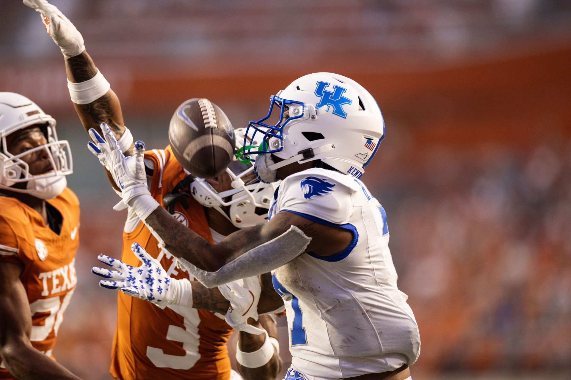 Kentucky Wildcats wide receiver Barion Brown (7) makes a catch against Texas Longhorns defender Jaylon Guilbeau (3) during the third quarter at Darrell K Royal-Texas Memorial Stadium.
