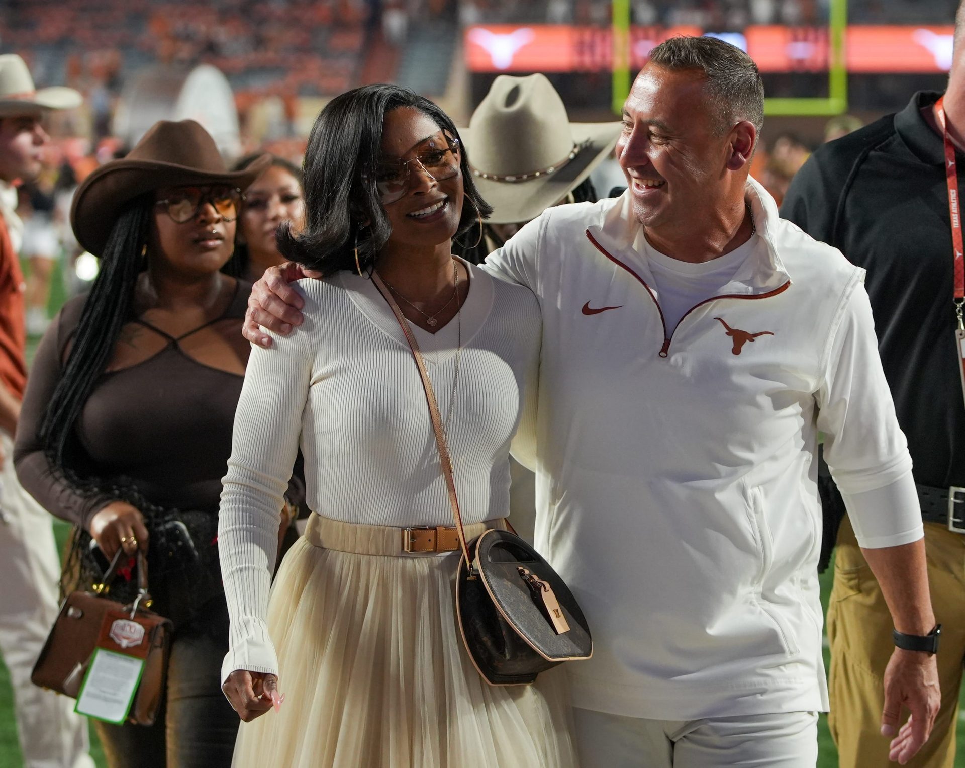 Texas Longhorns head coach Steve Sarkisian and his wife Loreal Sarkisian walk off the field after winning 31-14 against Kentucky Wildcats during the first half of an NCAA college football game at Darrell K Royal Texas Memorial Stadium, Austin, Texas, Saturday, Nov 24, 2024.