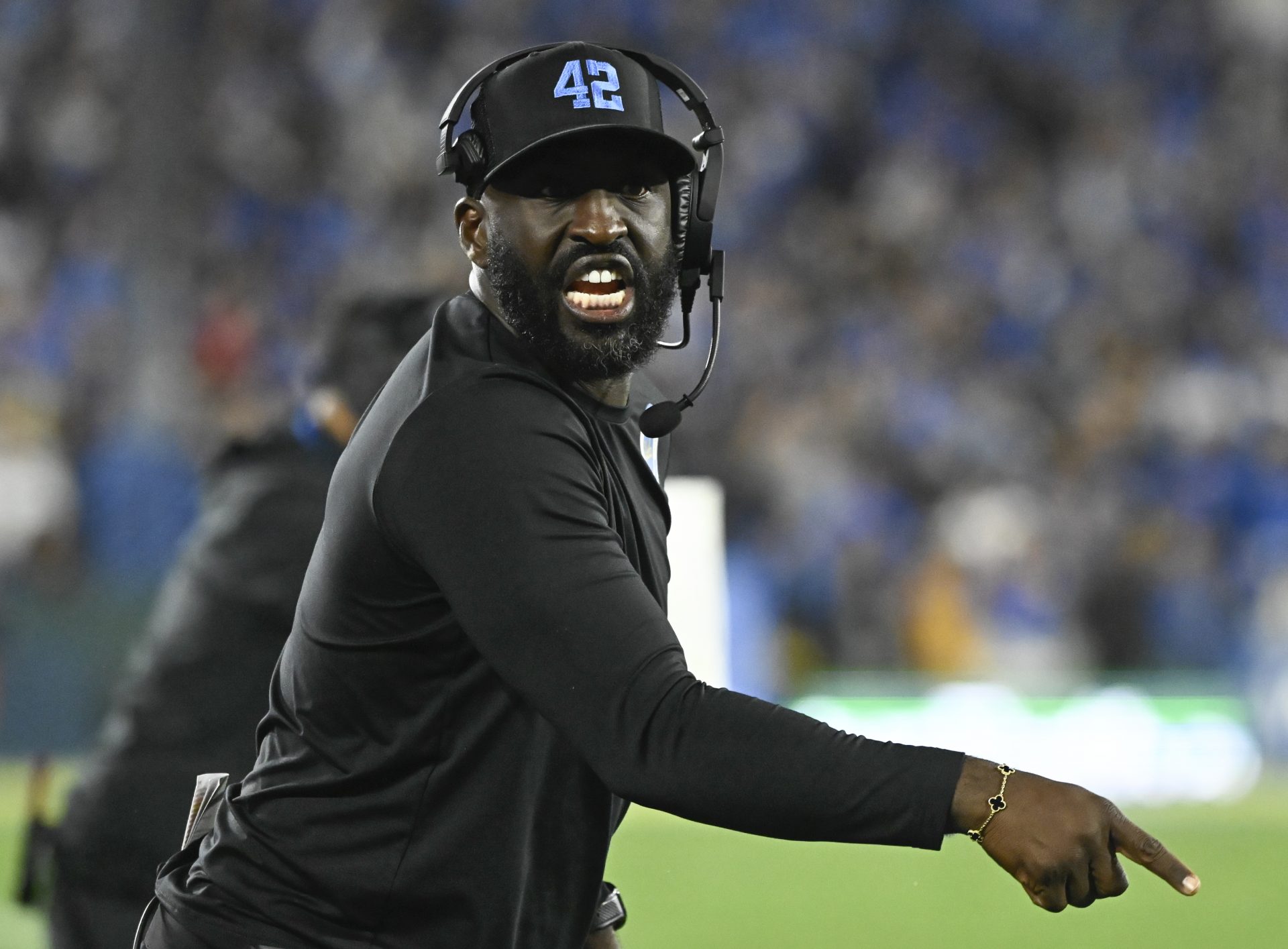 UCLA Bruins head coach DeShaun Foster yells at referees during the second quarter against the USC Trojans at Rose Bowl.